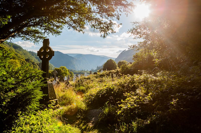 Celtic cross in Irish landscape