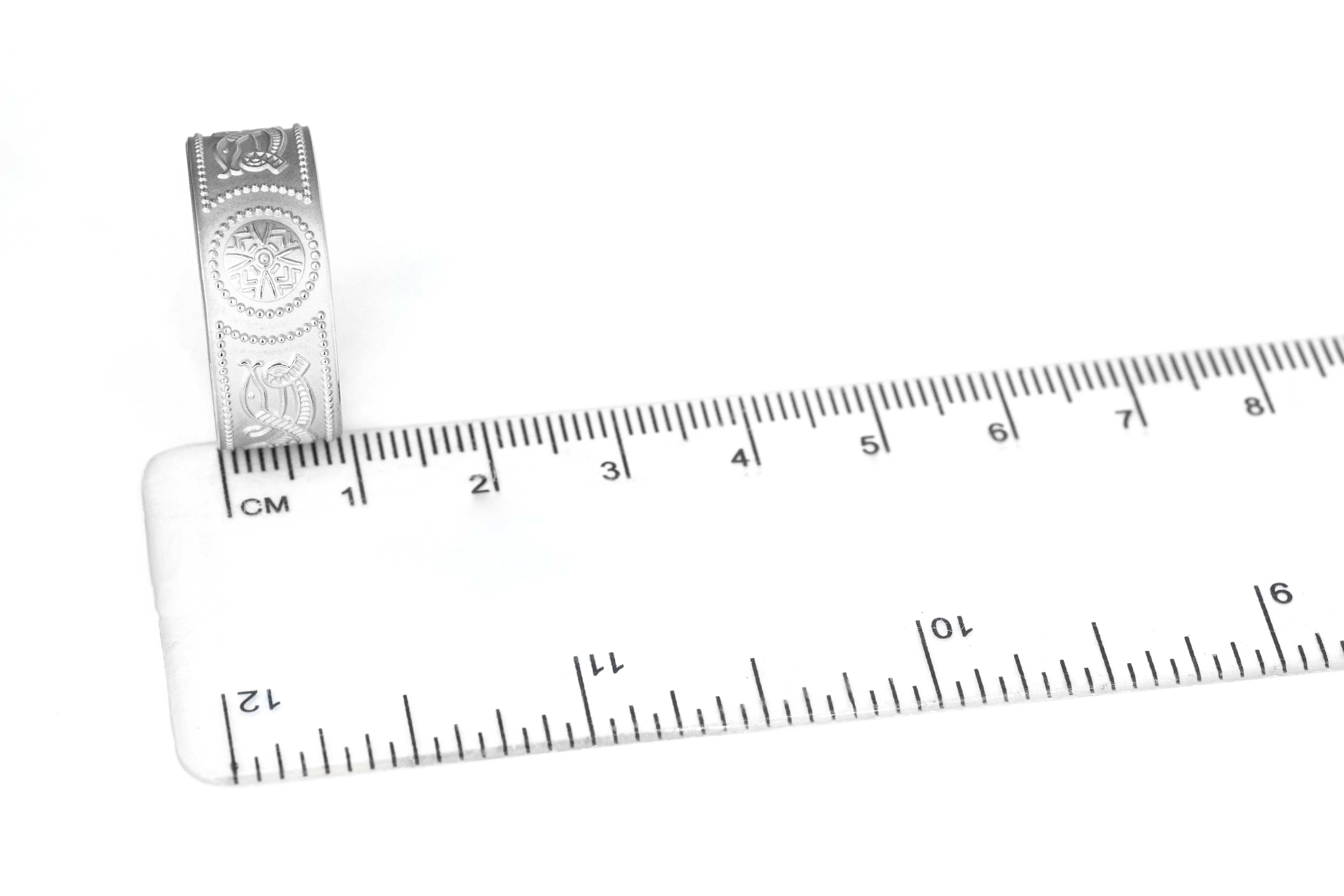 Striking White Gold Celtic Warrior 6.0mm Ring With a Florentine Finish For Men. Picture For Scale.