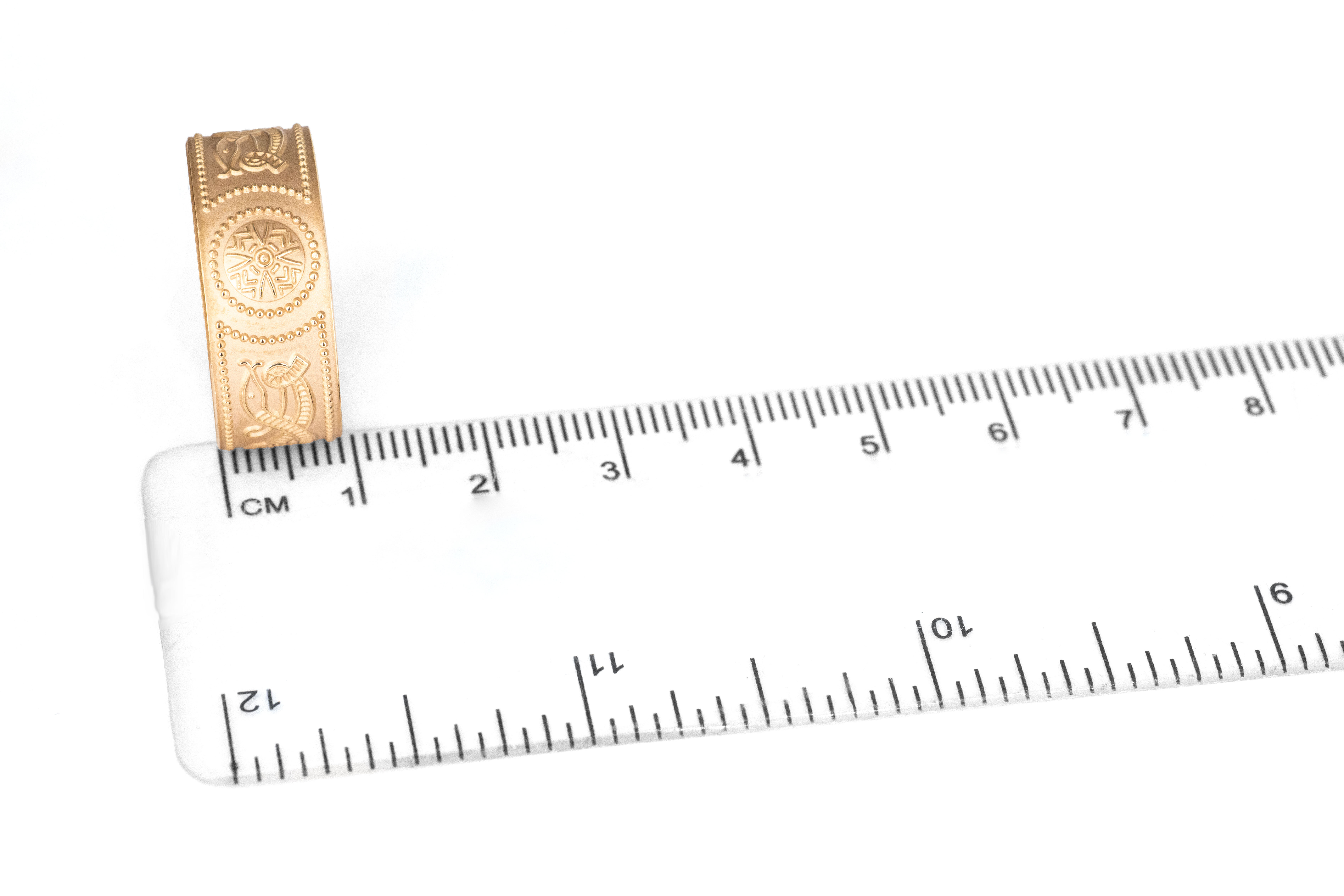 Luxurious Yellow Gold Celtic Warrior 9.0mm Ring With a Florentine Finish For Men. Picture For Scale.