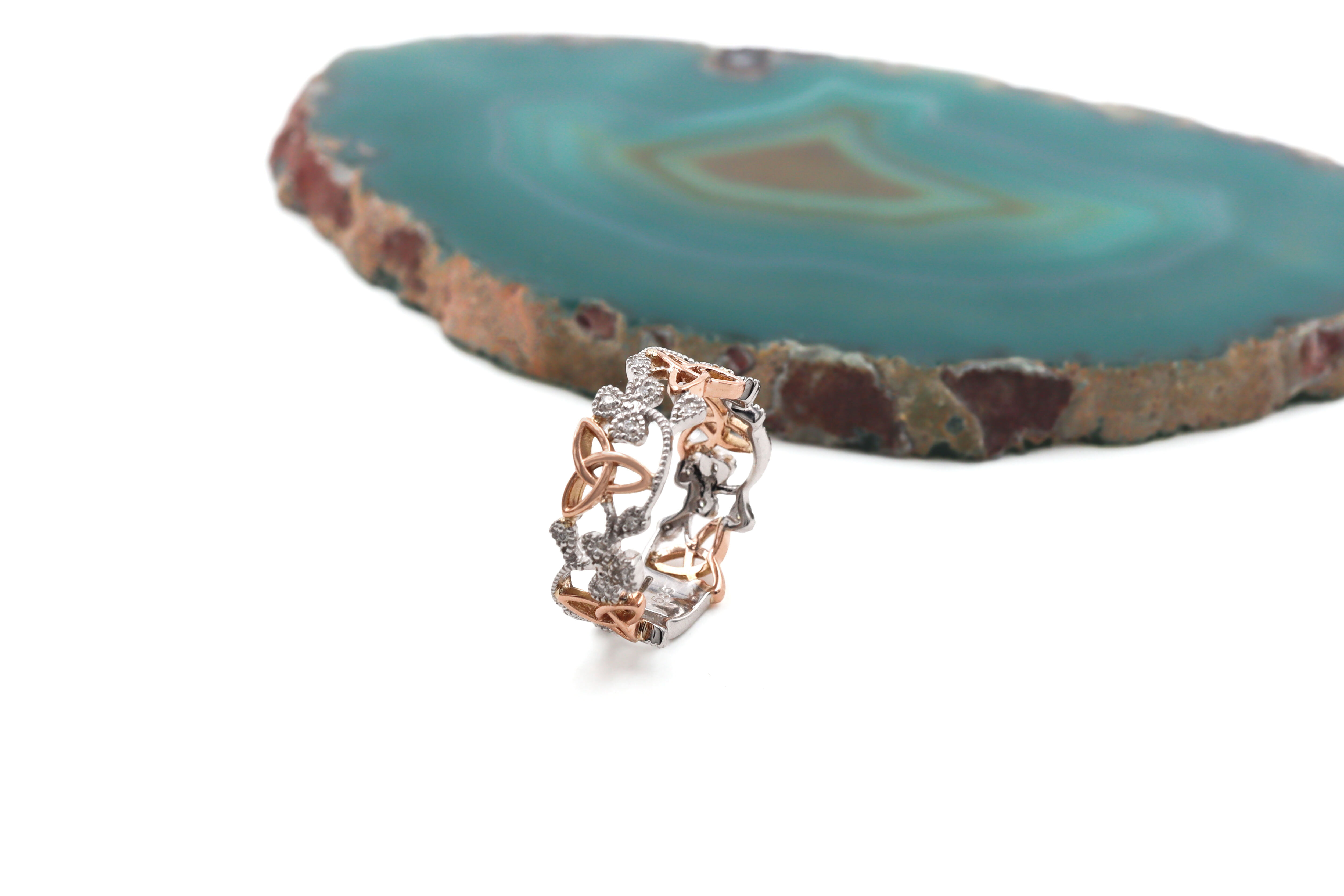 Real White Gold & Rose Gold Shamrock Anniversary Ring For Women With a Polished Finish. Side View.