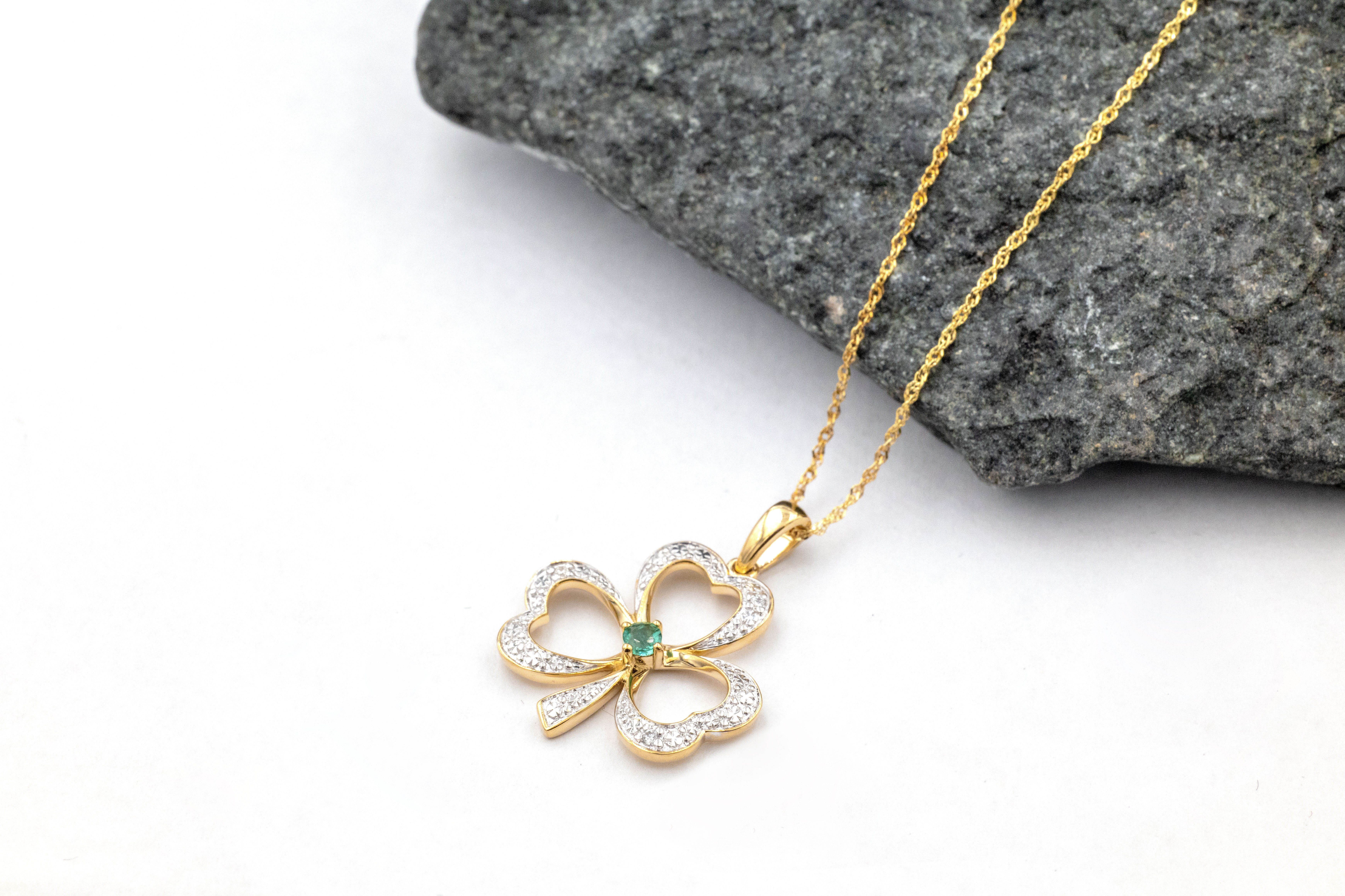 Irish Yellow Gold Shamrock Necklace For Women. Pictured Flat.