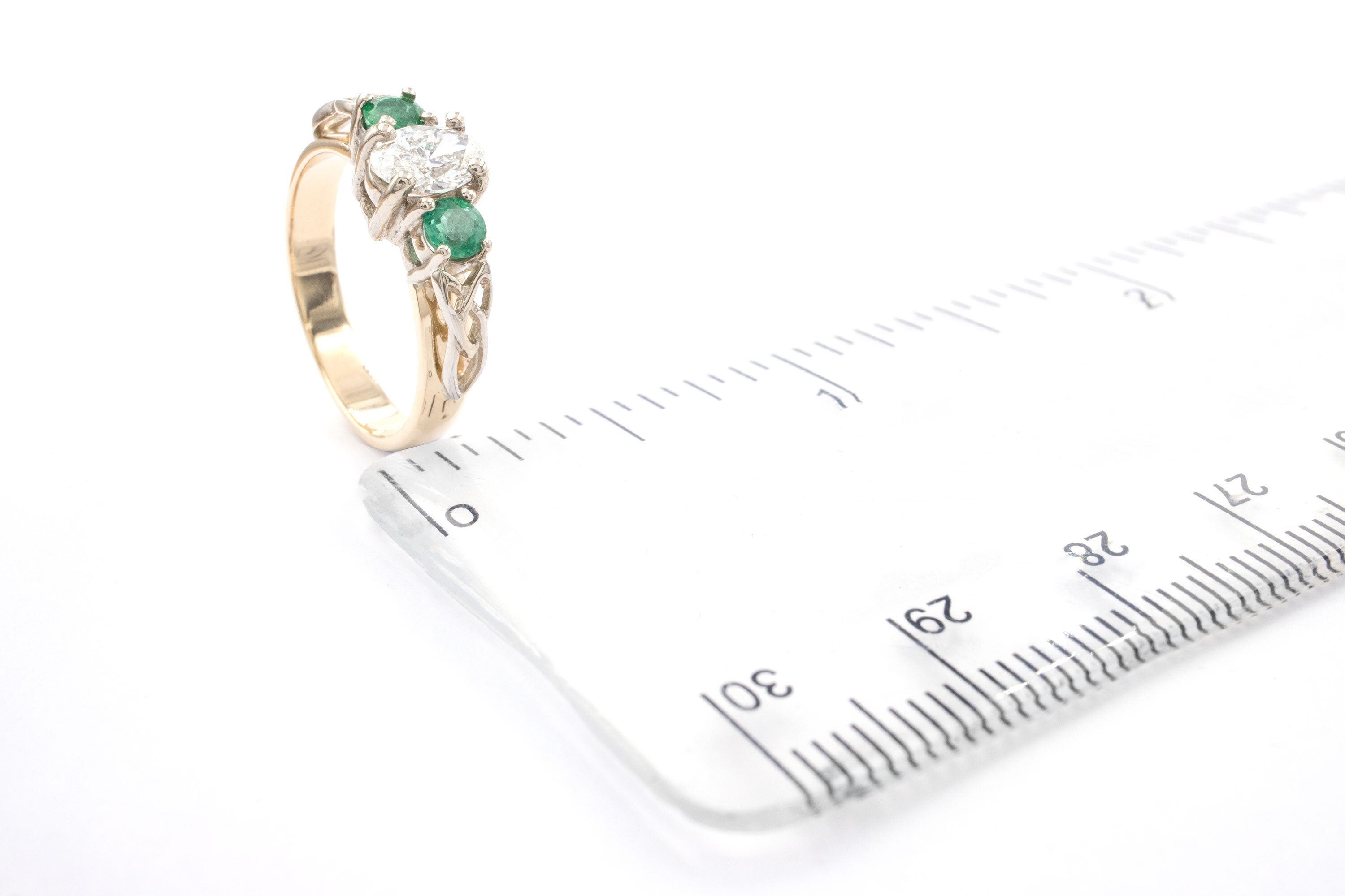 Attractive 14K Yellow Gold & White Gold Trinity Knot 0.40ct Lab Grown Diamond Engagement Ring For Women With a Polished Finish. Picture For Scale.