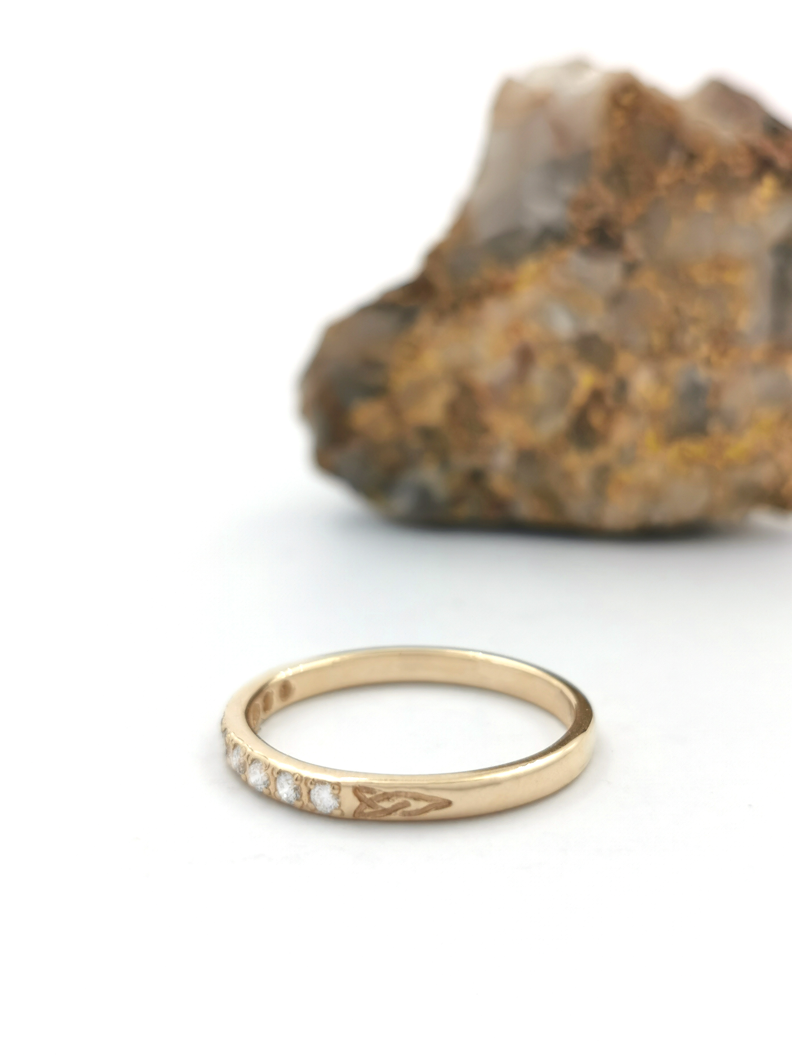 Womens Trinity Knot Engagement Ring in Yellow Gold With a Polished Finish. Side View.