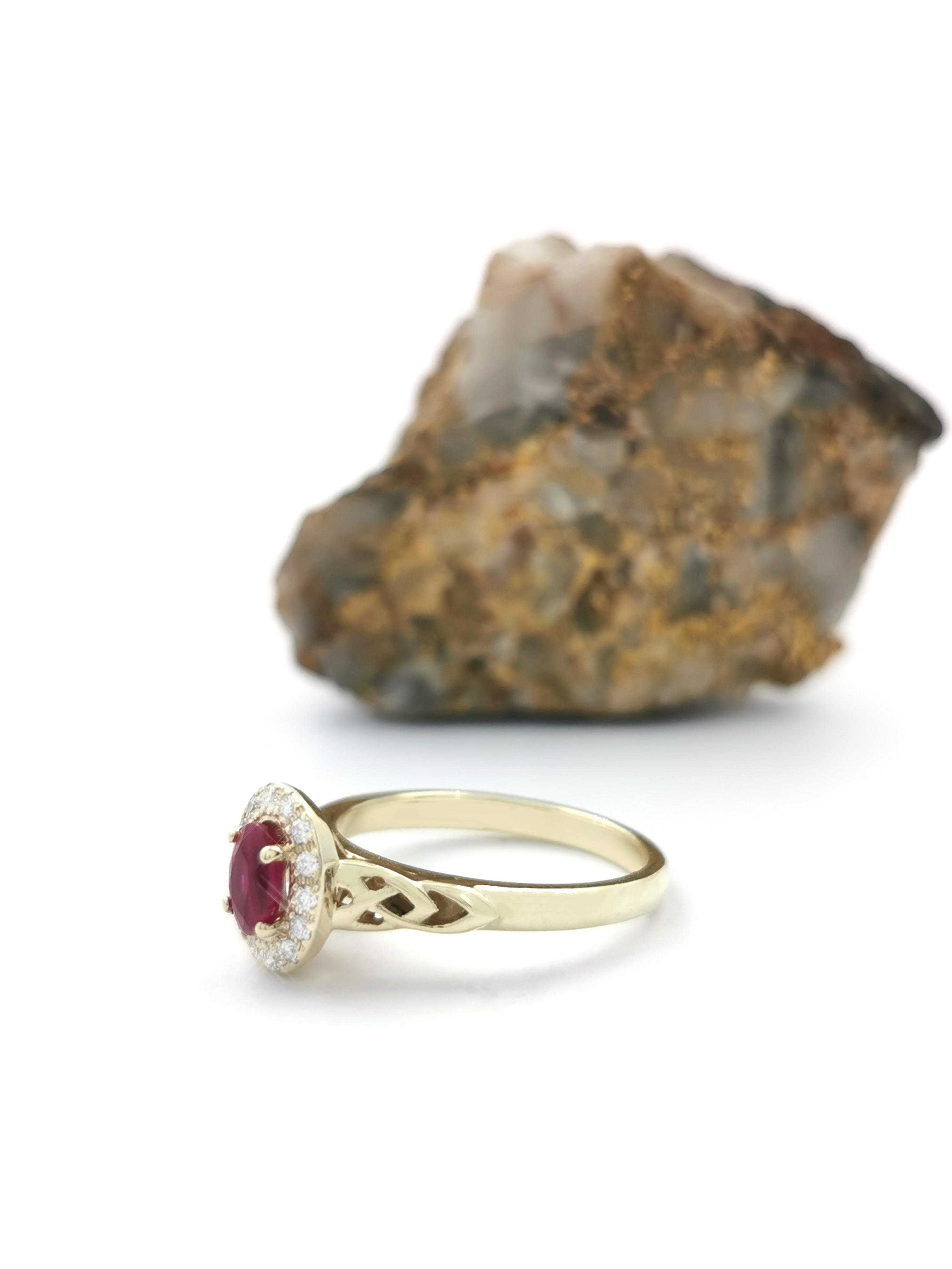 Gorgeous 18K Yellow Gold Trinity Knot 0.50ct Natural Ruby Engagement Ring With a Polished Finish For Women. Side View.
