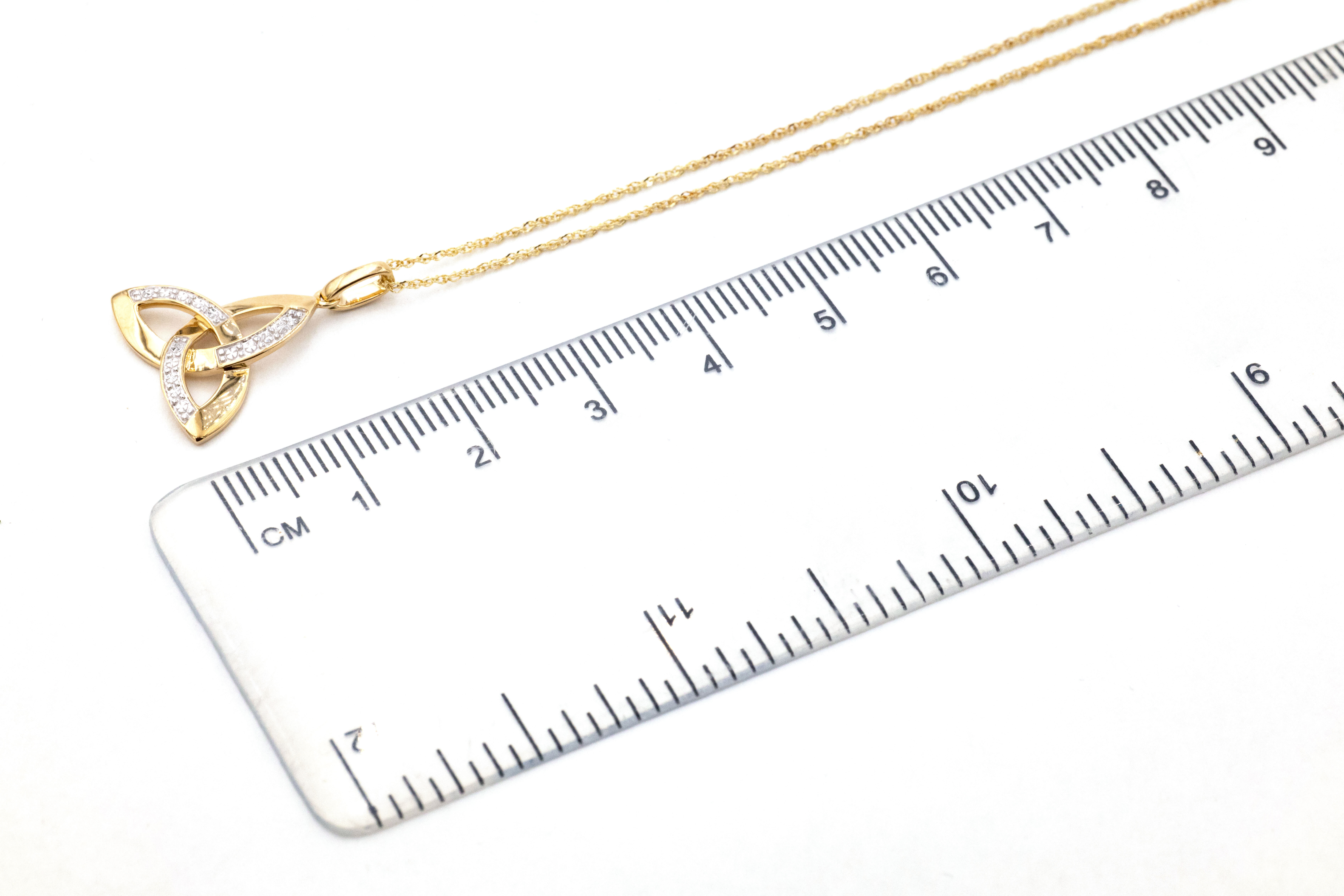 Irish Yellow Gold Celtic Knot Necklace For Women. Picture For Scale.