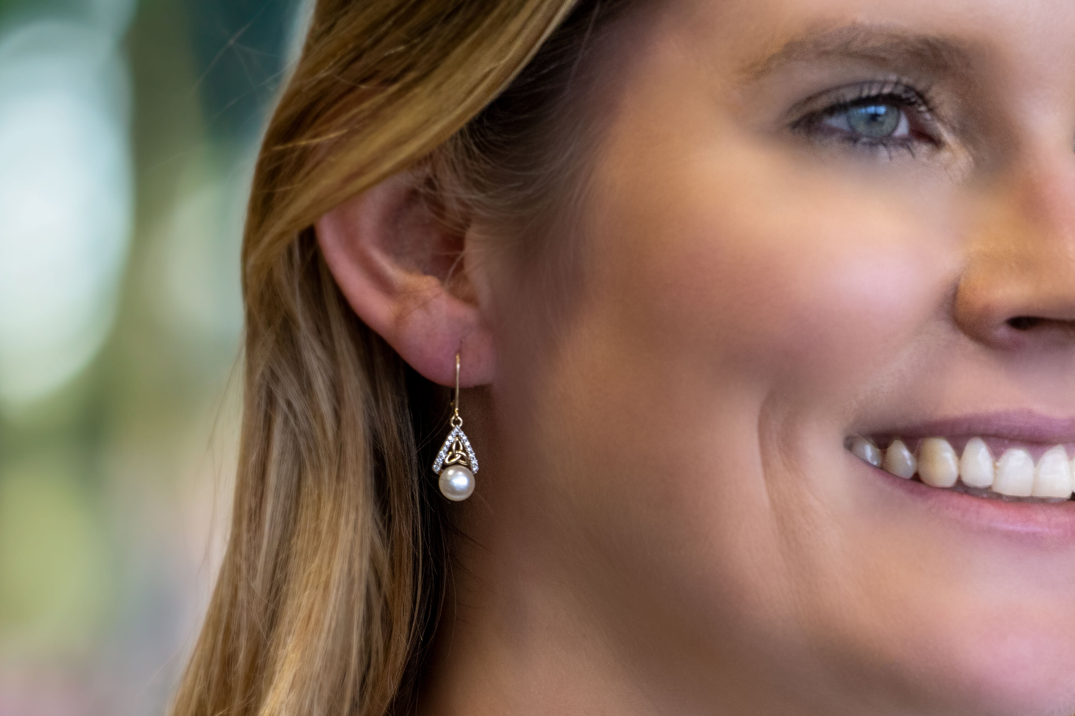 Womens Polished Yellow Gold Trinity Knot Earrings - Model Photo