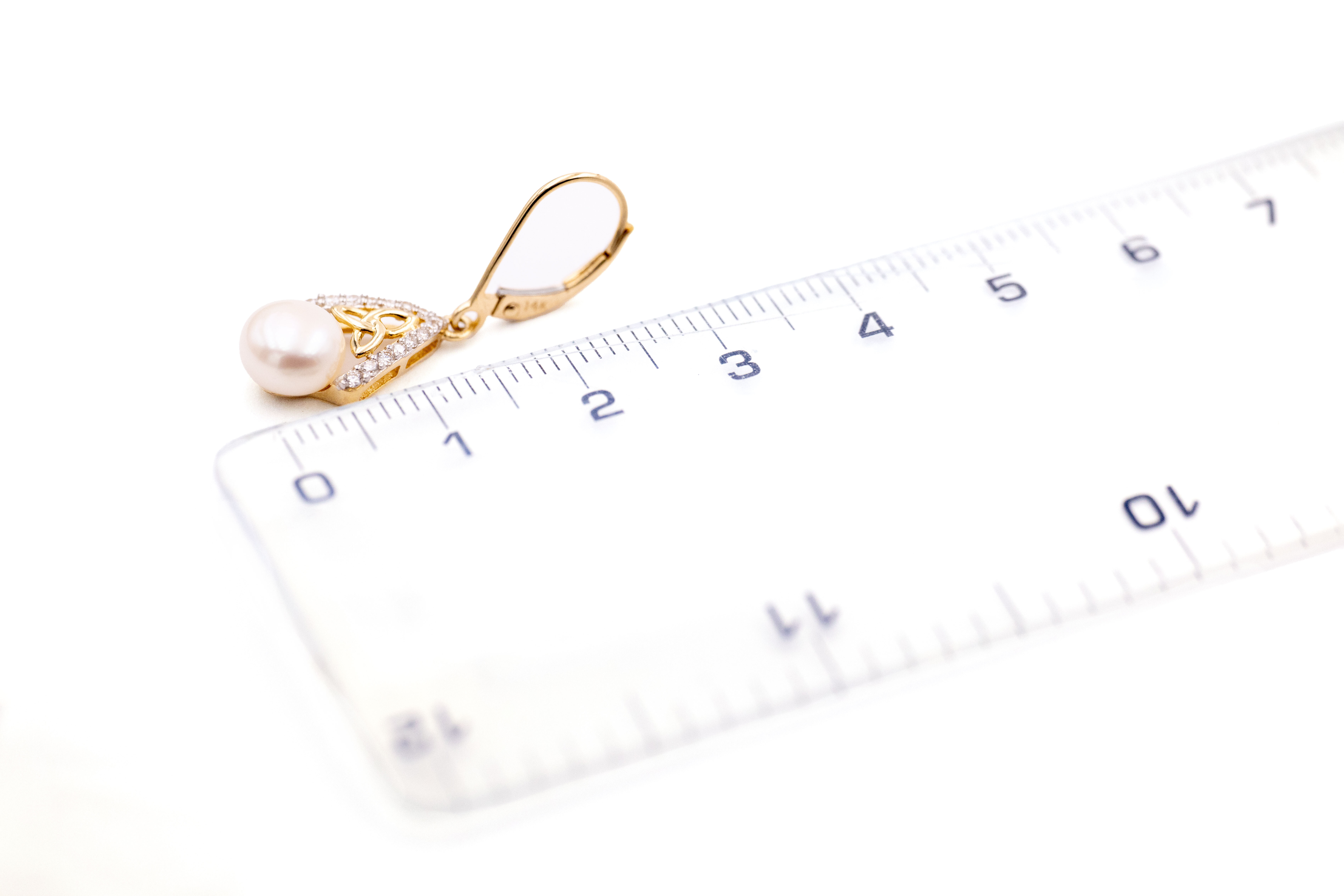 Womens Polished 14K Yellow Gold Trinity Knot Earrings. Picture For Scale.