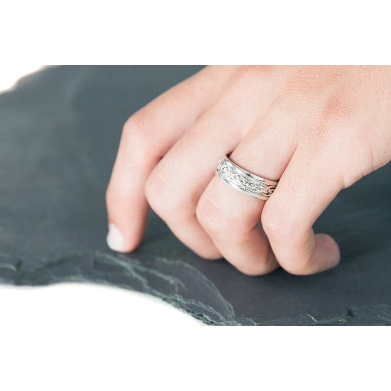 Striking Sterling Silver Celtic Knot Wedding Ring For Men - Model Photo