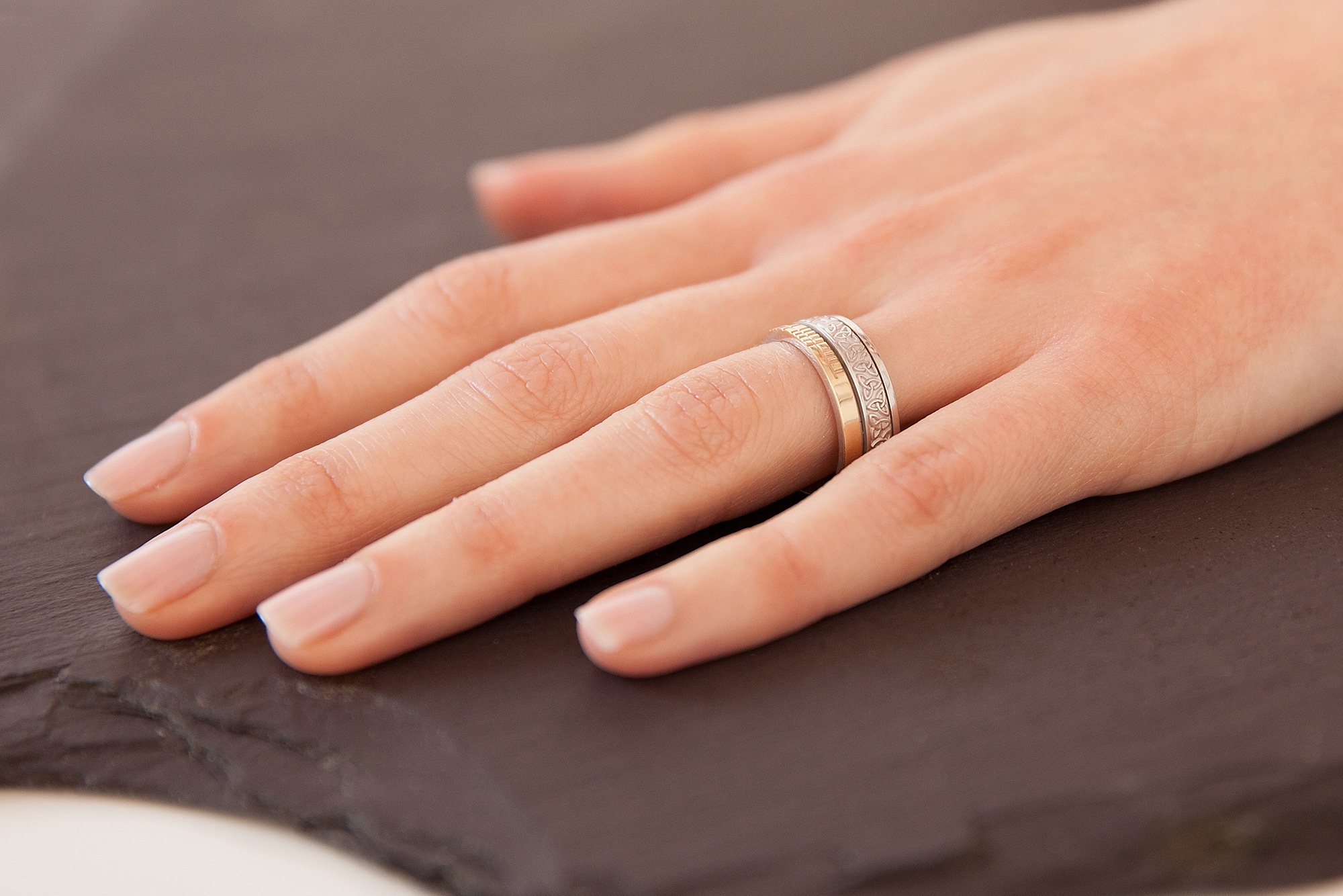 Striking 10K White Gold & Yellow Gold Ogham & Trinity Knot 7.3mm Ring With a Florentine Finish - Model Photo