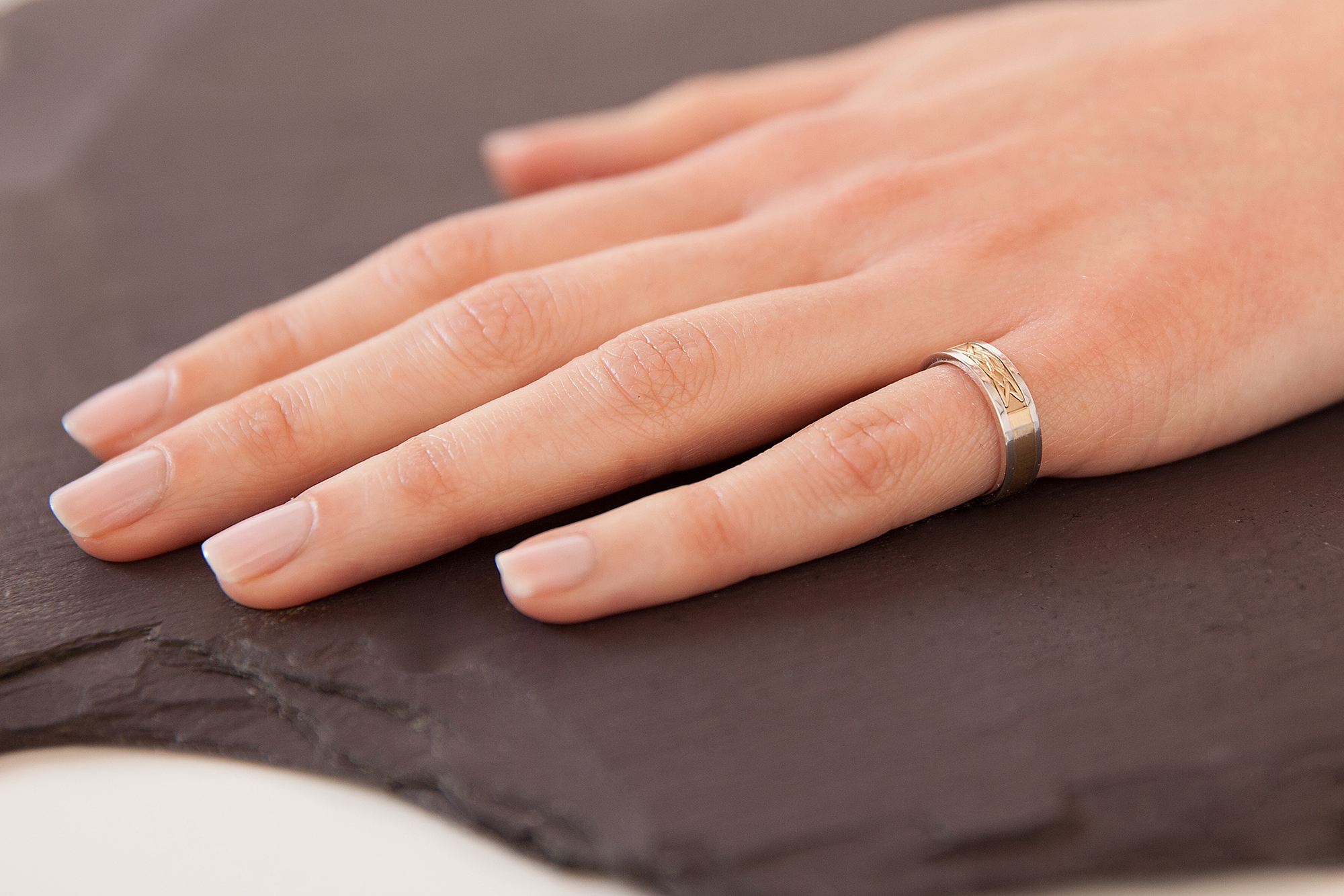 Striking 10K White Gold & Yellow Gold Celtic Knot 5.0mm Ring For Women - Model Photo