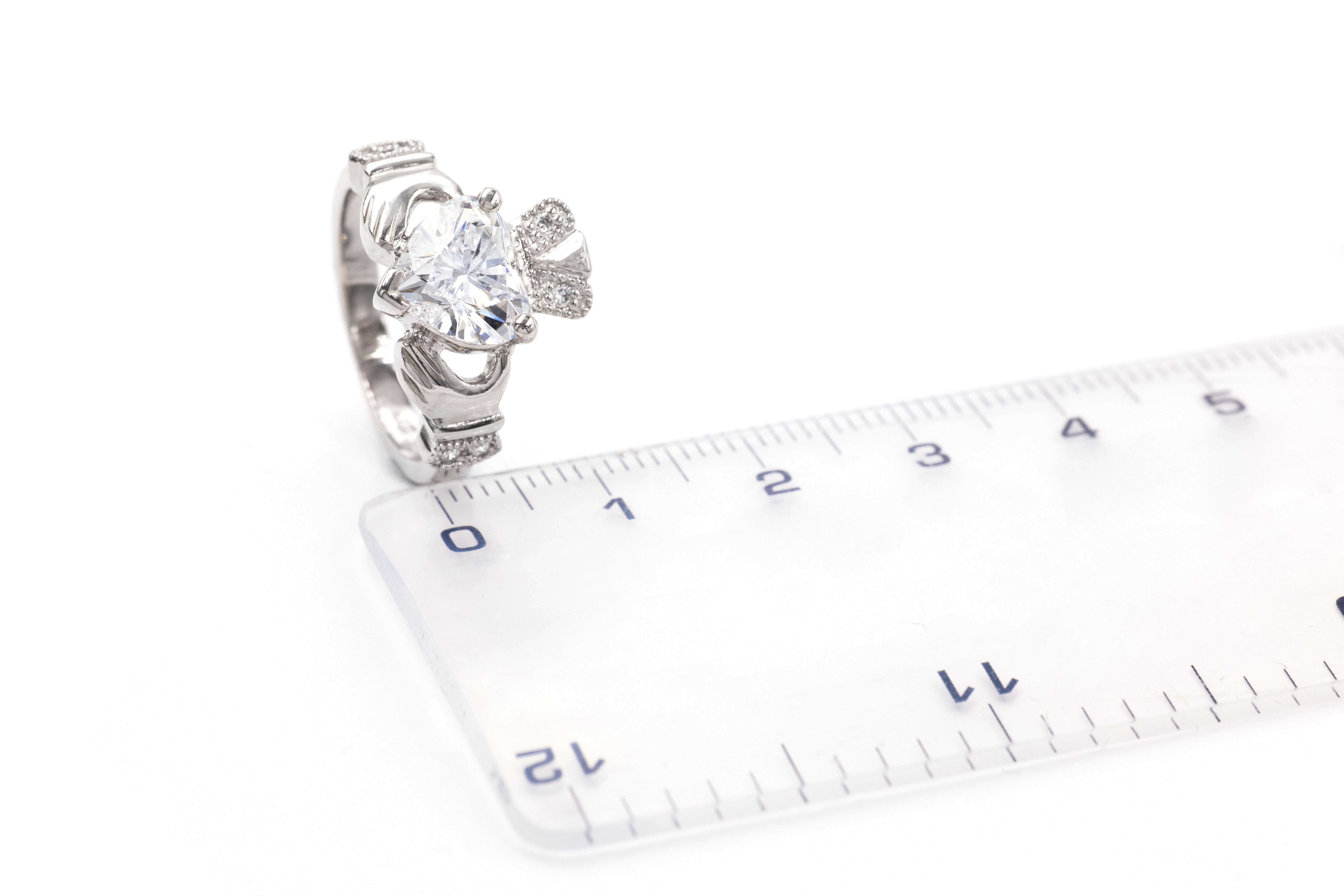 Gorgeous White Gold Claddagh 2.0mm Ring With a Polished Finish For Women. Picture For Scale.