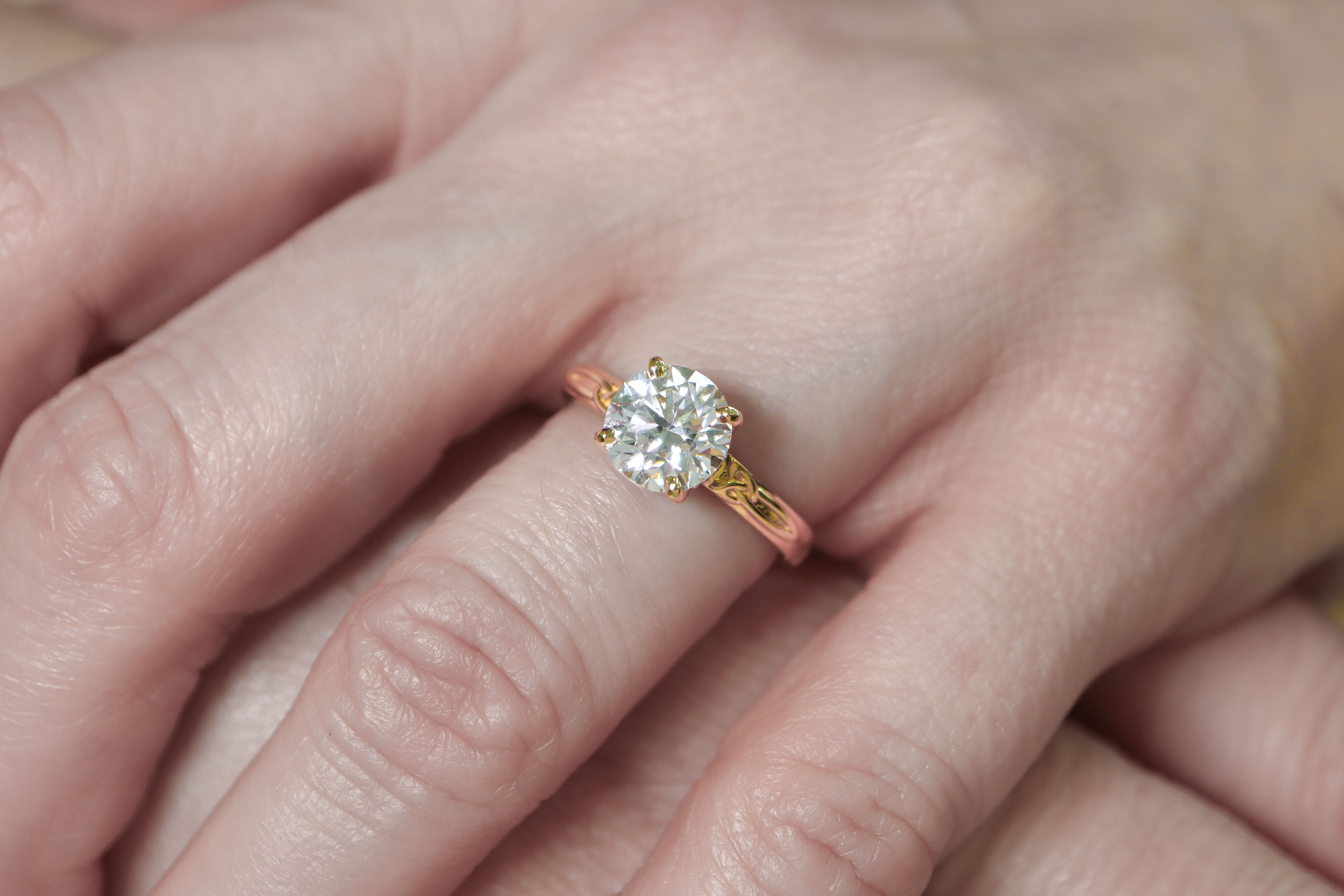 Striking Yellow Gold Trinity Knot 2.00ct Lab Grown Diamond Ring For Women With a Polished Finish - Model Photo