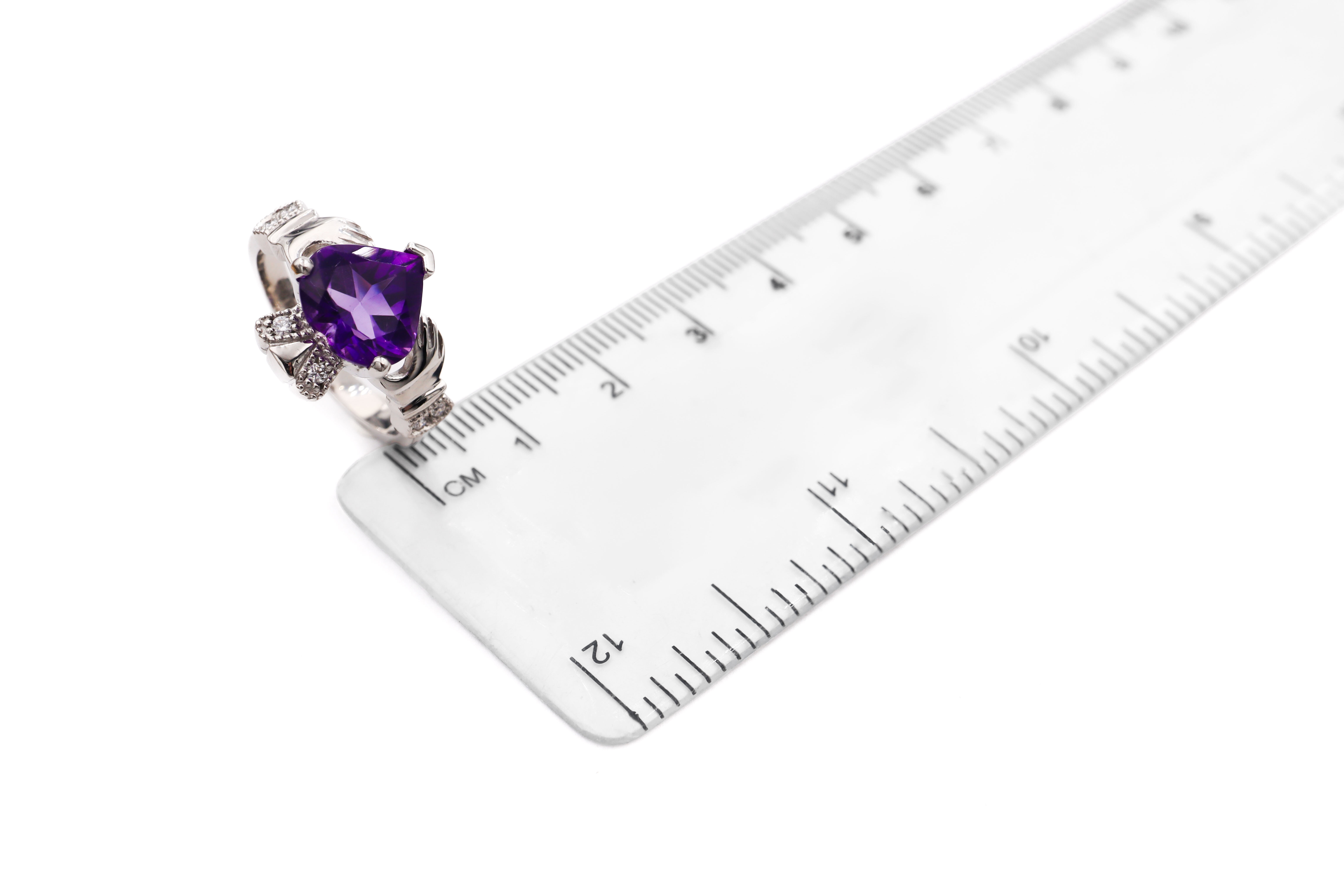 Attractive Platinum Claddagh Ring With a Polished Finish For Women. Picture For Scale.