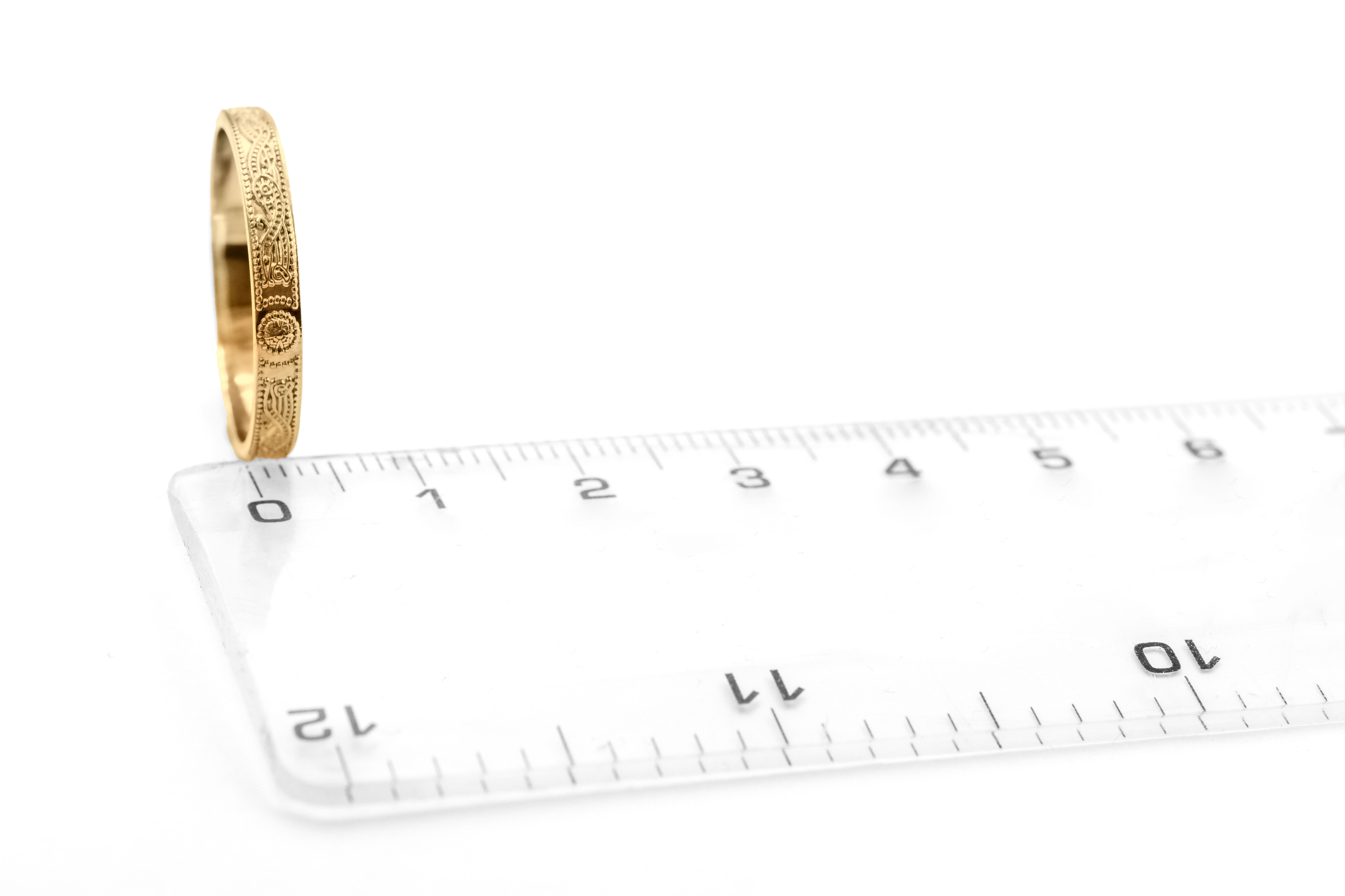 Womens Celtic Warrior & Celtic Knot Wedding Ring in Yellow Gold With a Florentine Finish. Picture For Scale.