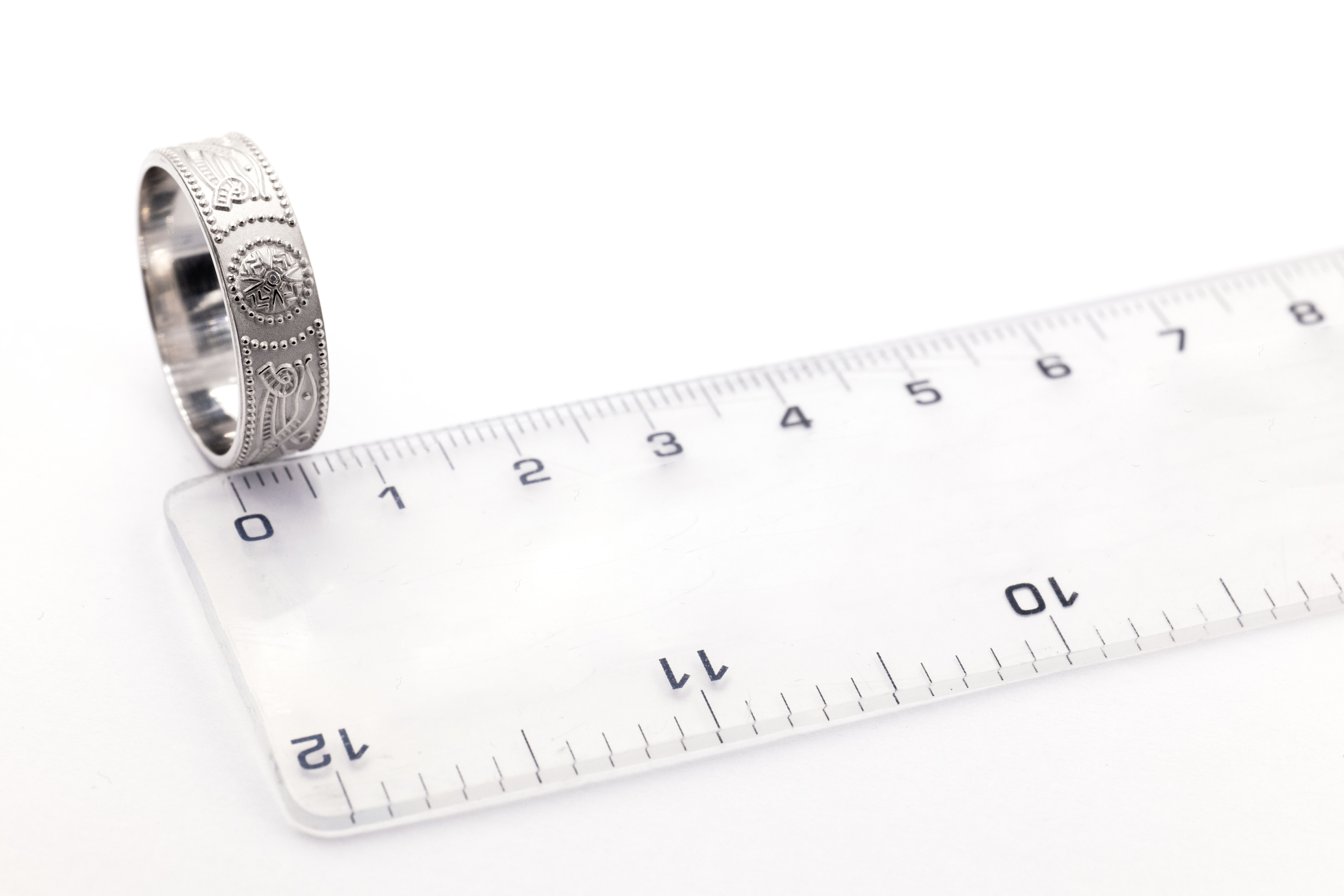 Authentic Sterling Silver Celtic Warrior Wedding Ring For Men With a Florentine Finish. Picture For Scale.