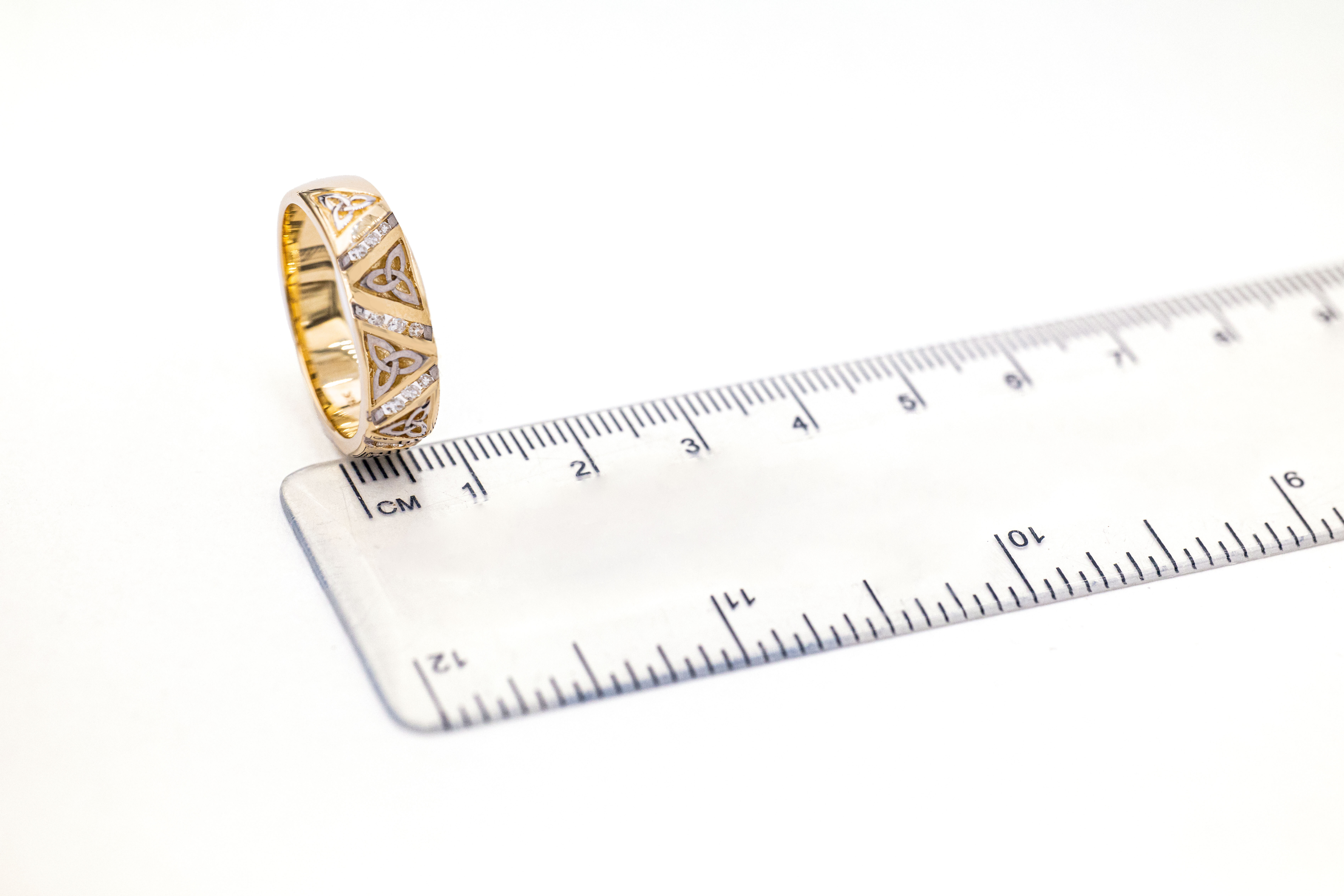 Striking Yellow Gold Trinity Knot Wedding Ring For Men. Picture For Scale.