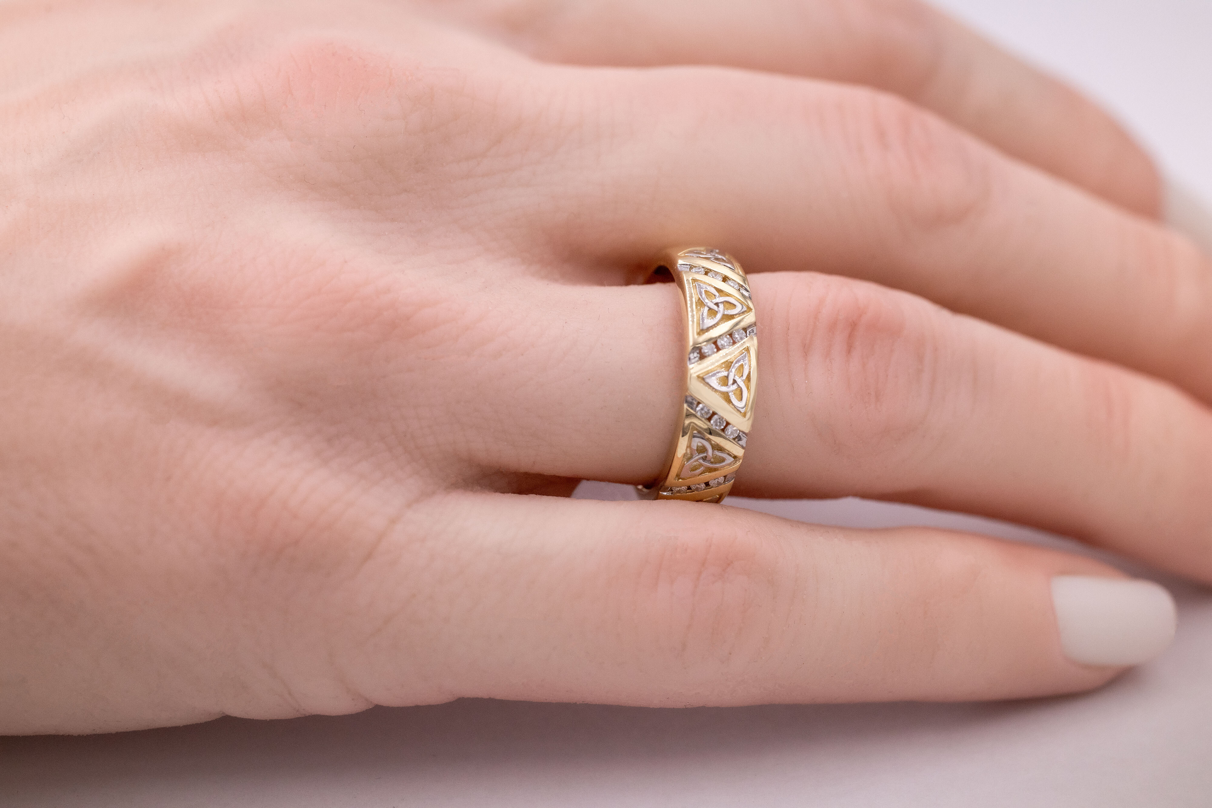 Striking 14K Yellow Gold Trinity Knot Wedding Ring For Men - Model Photo