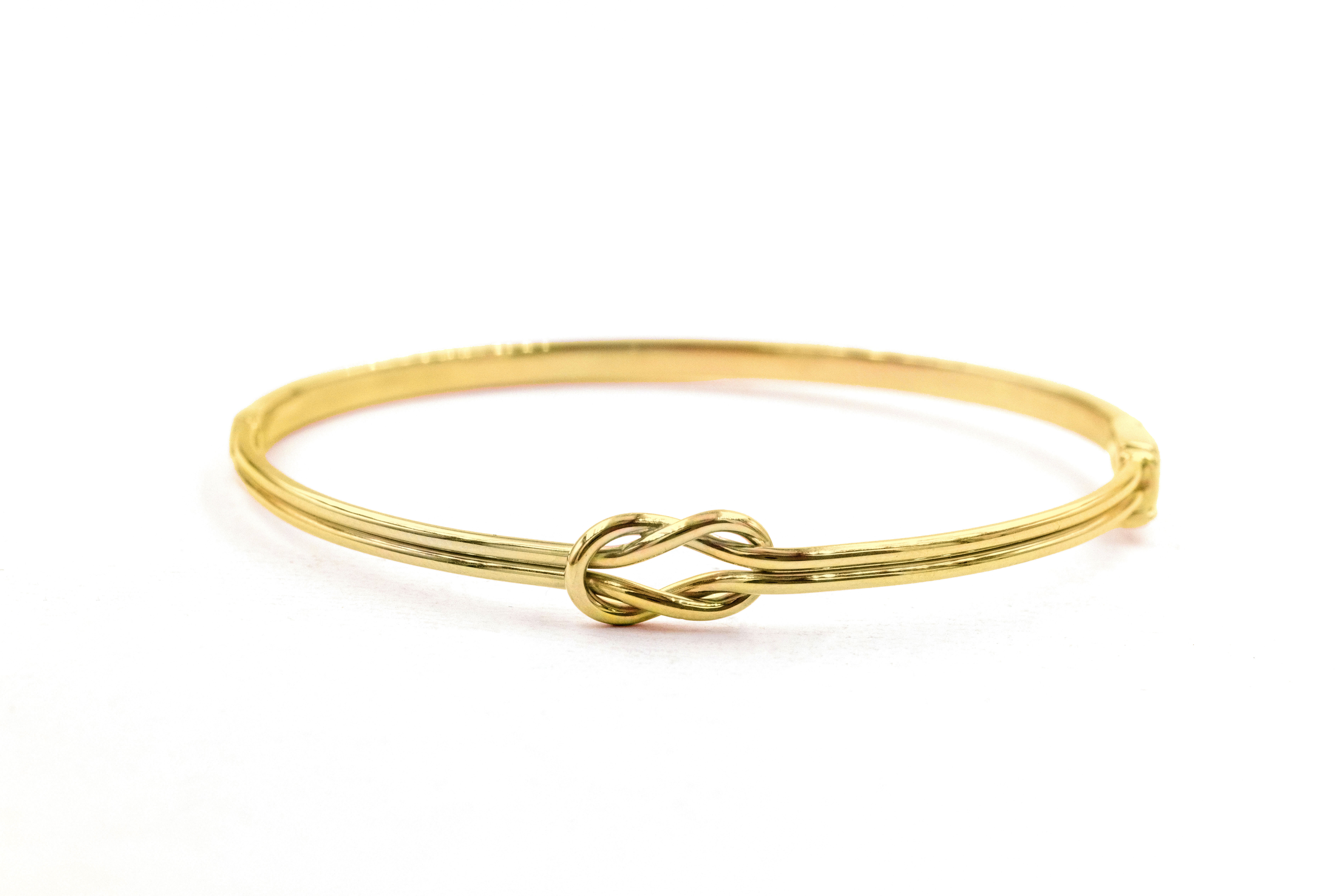 Authentic 9K Yellow Gold Celtic Knot Bracelet For Women With a Polished Finish