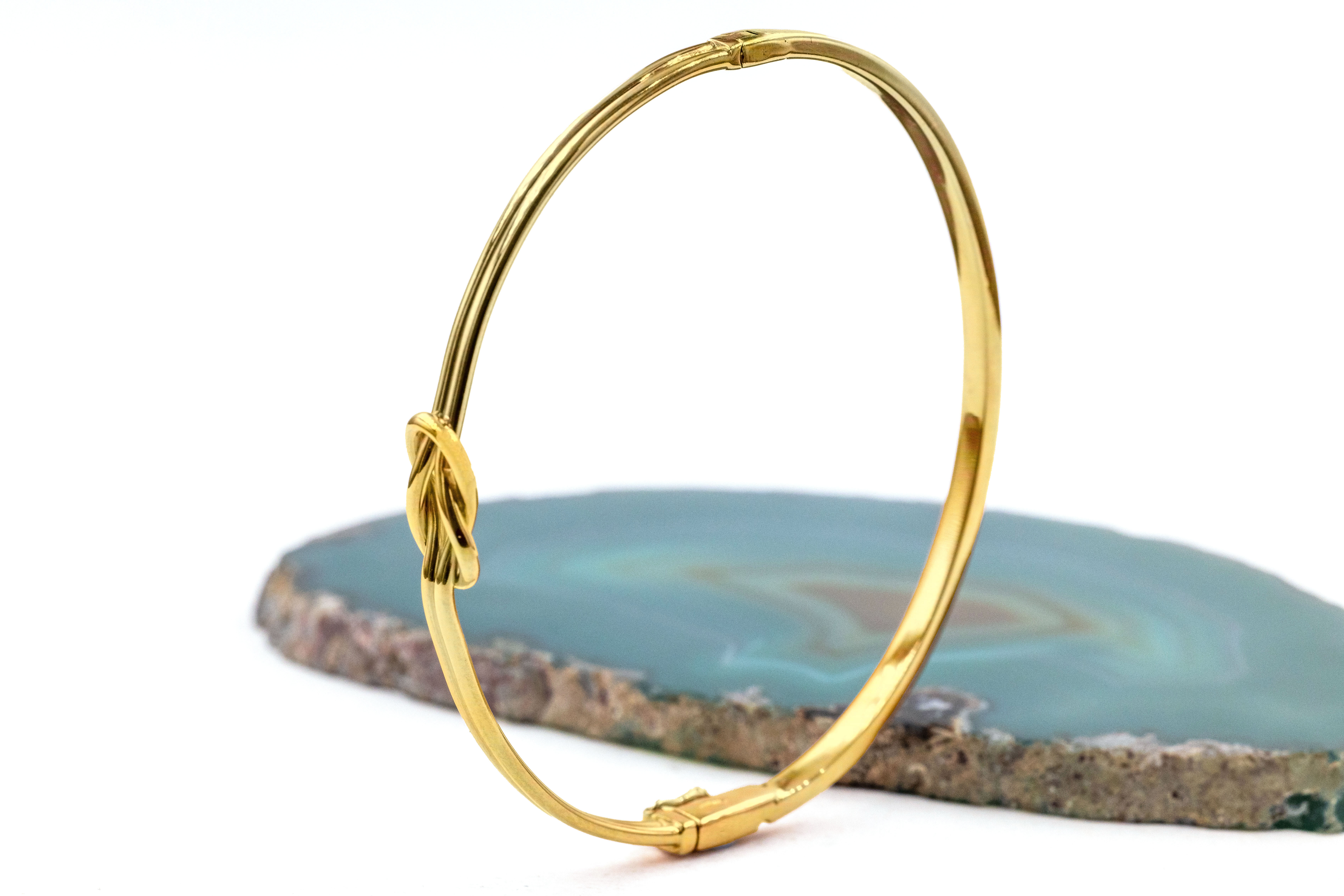 Real Yellow Gold Celtic Knot Bracelet For Women With a Polished Finish. Side View.