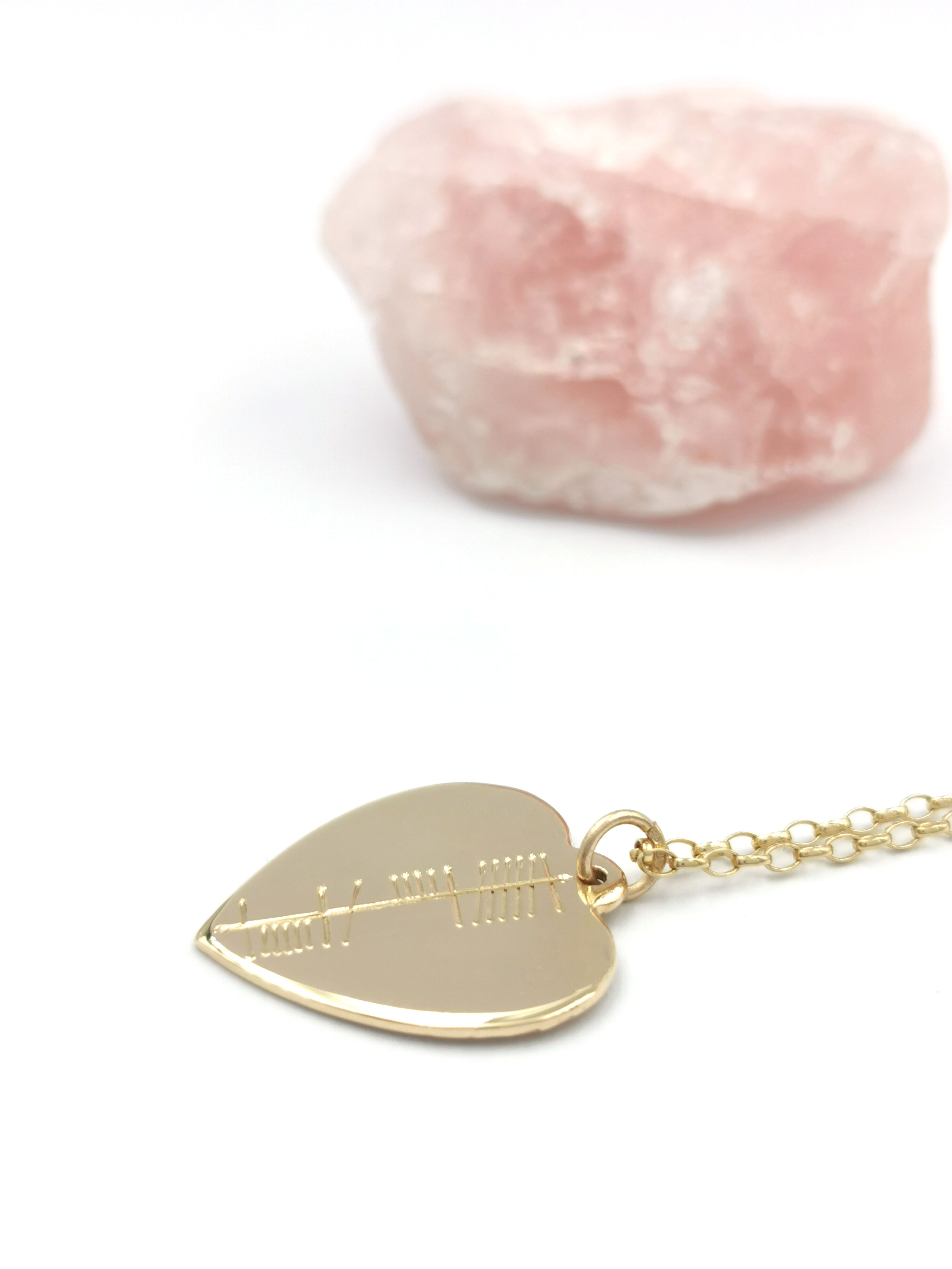 Womens Yellow Gold Ogham Necklace. Pictured Flat.