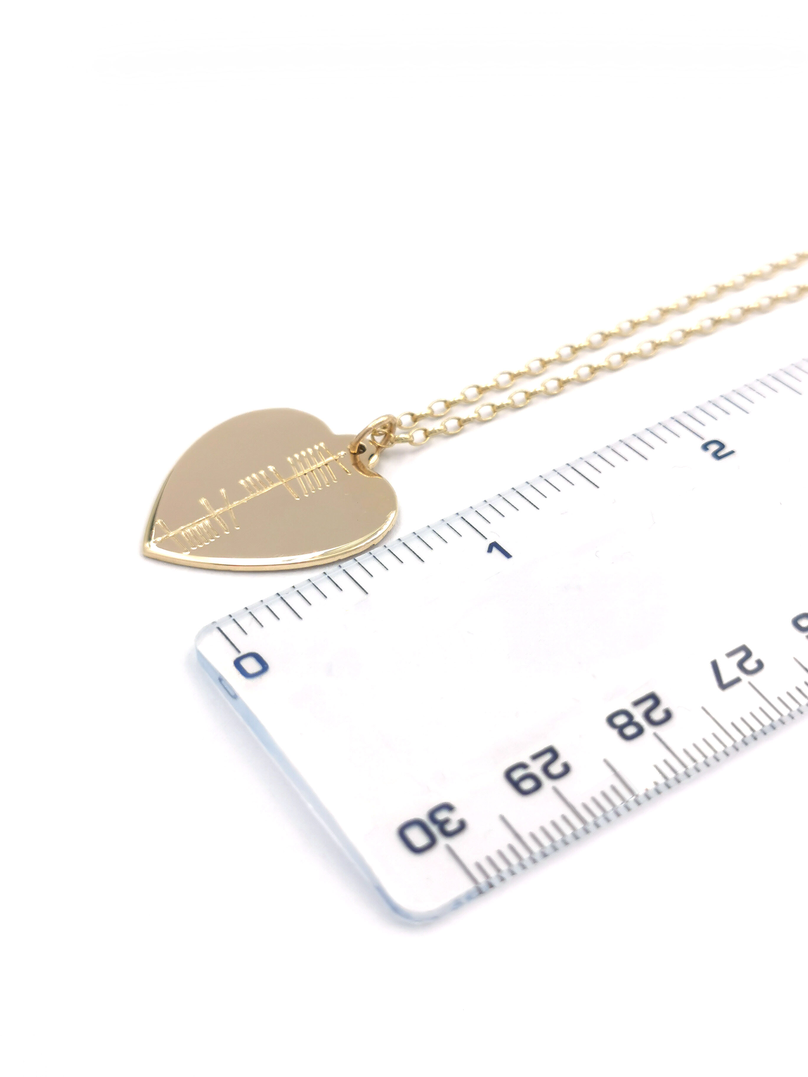 Womens Ogham Necklace in Yellow Gold. Picture For Scale.