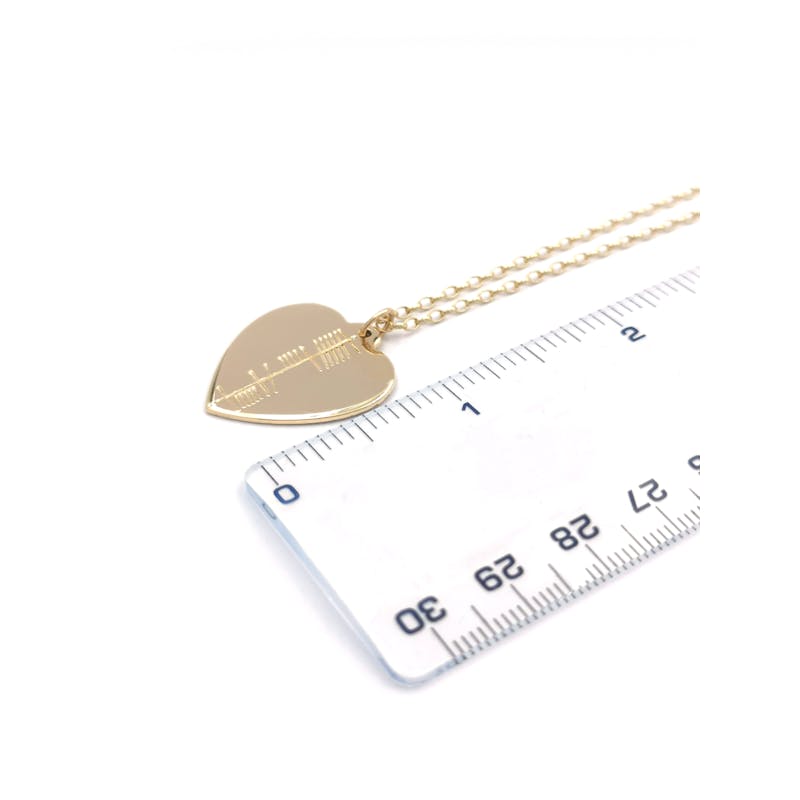 Womens Ogham Necklace in Yellow Gold. Picture For Scale.