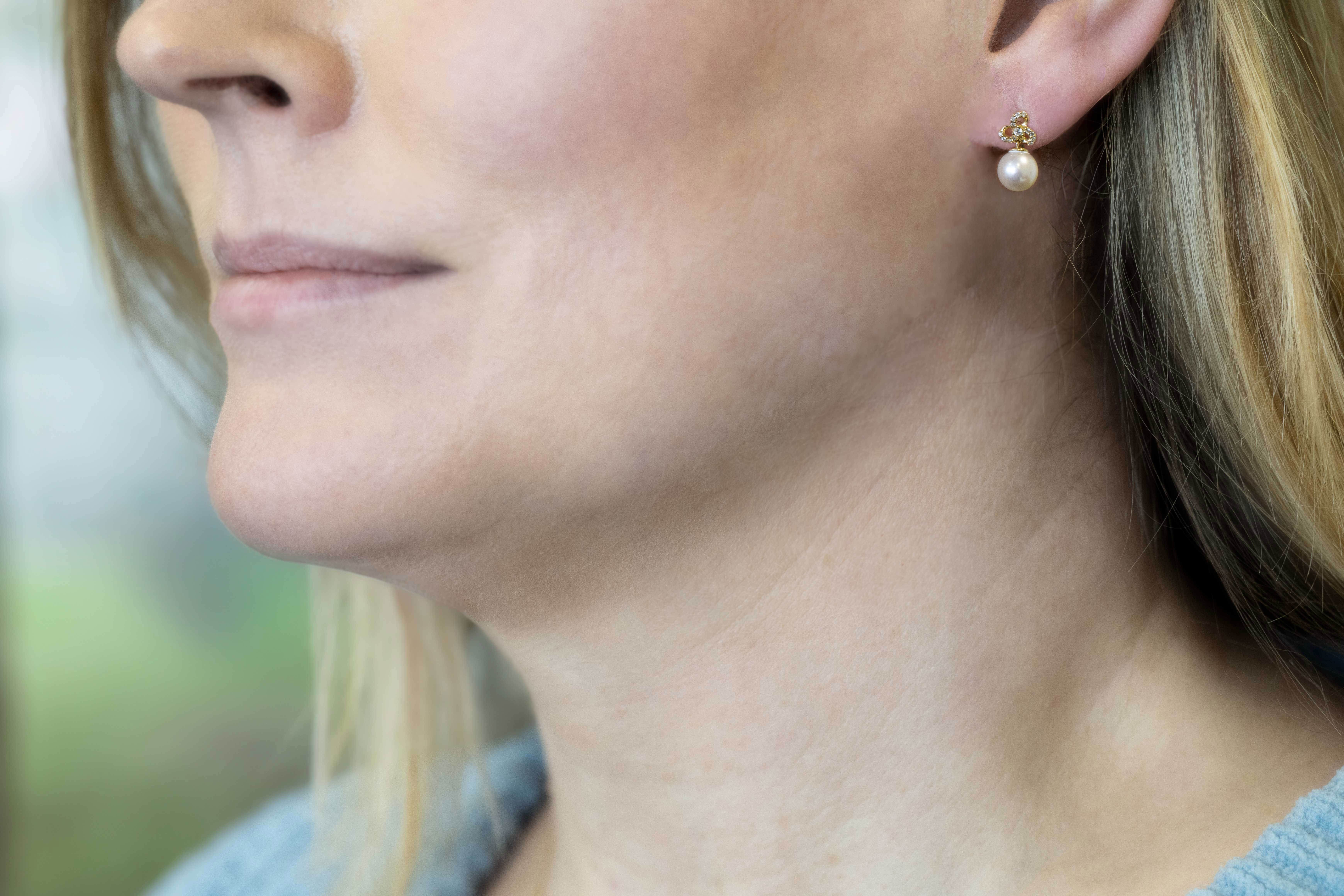 Gorgeous 9K White Gold Trinity Knot Earrings With a Polished Finish For Women - Model Photo