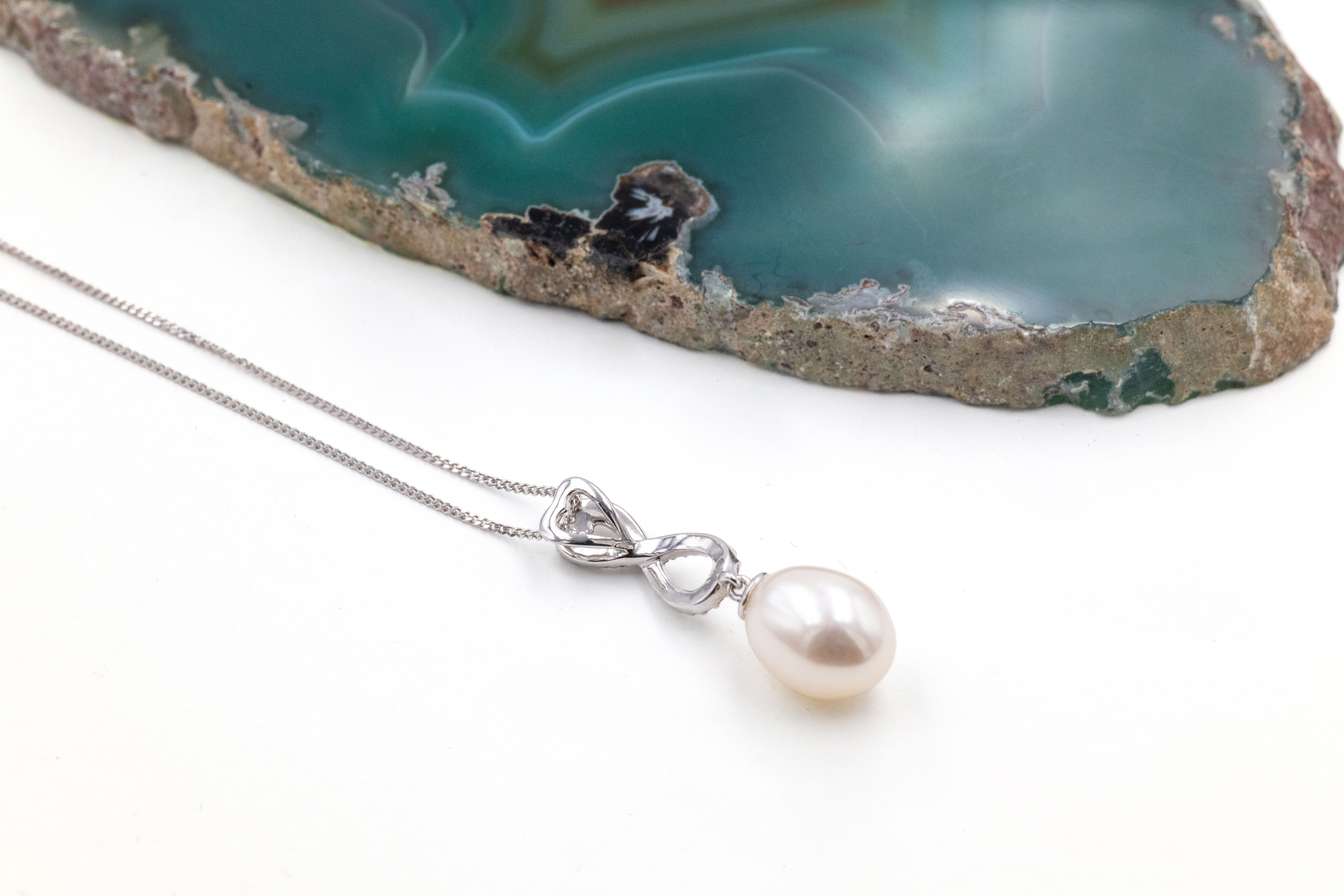 Striking 9K White Gold Celtic Knot Necklace For Women With a Polished Finish. Picture Of The Back.