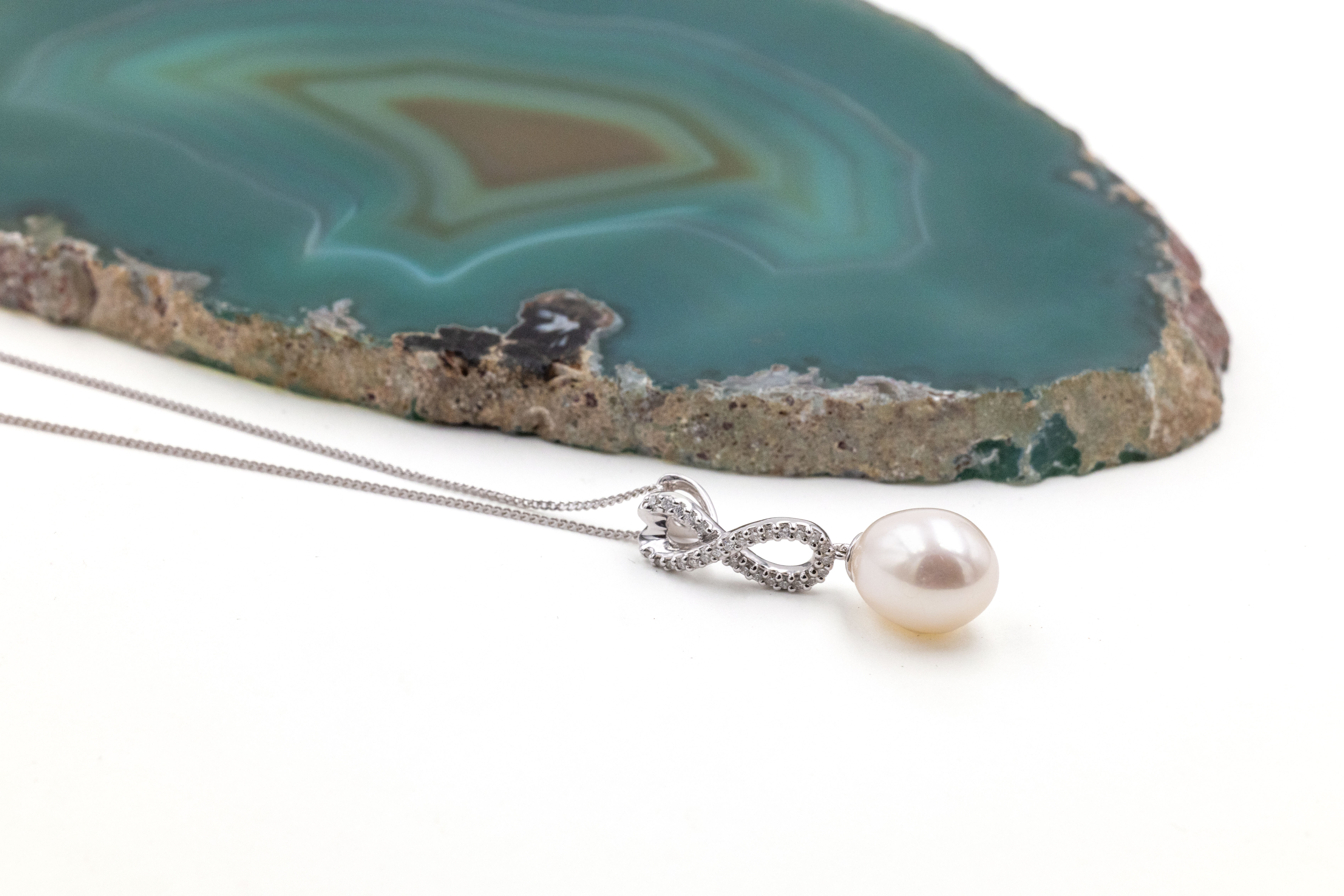 Gorgeous White Gold Celtic Knot Necklace With a Polished Finish For Women