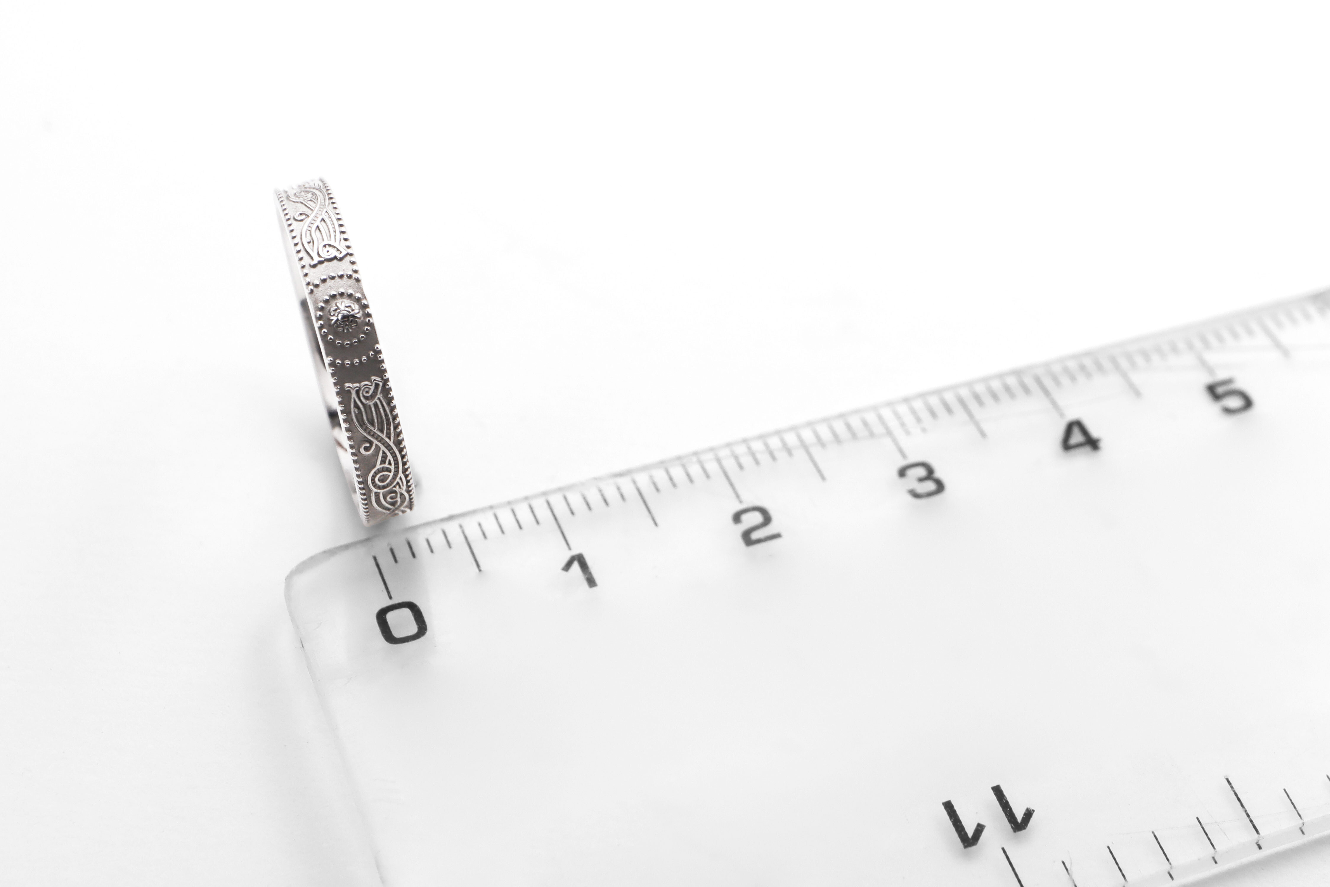 Womens Florentine Celtic Warrior & Celtic Knot 9.0mm Ring in Real White Gold. Picture For Scale.
