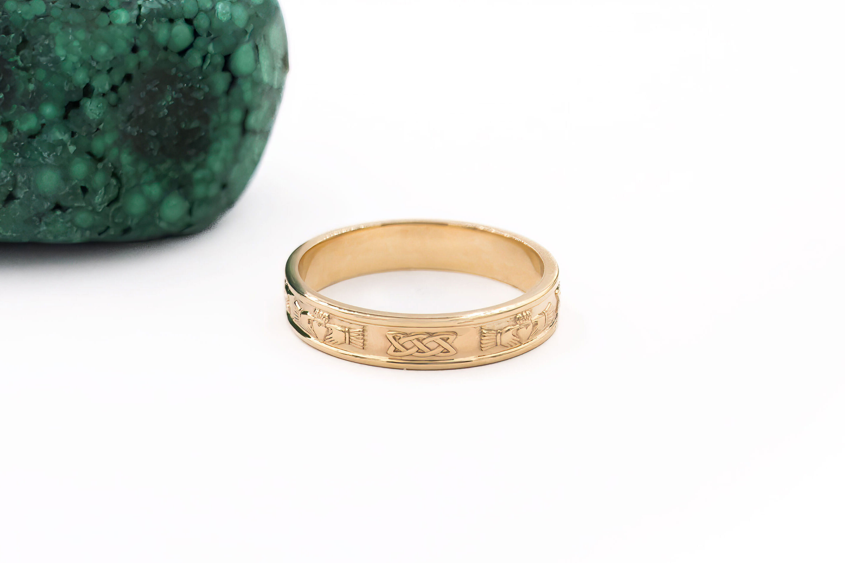 Real Yellow Gold Claddagh Wedding Ring For Women With a Polished Finish. Side View.