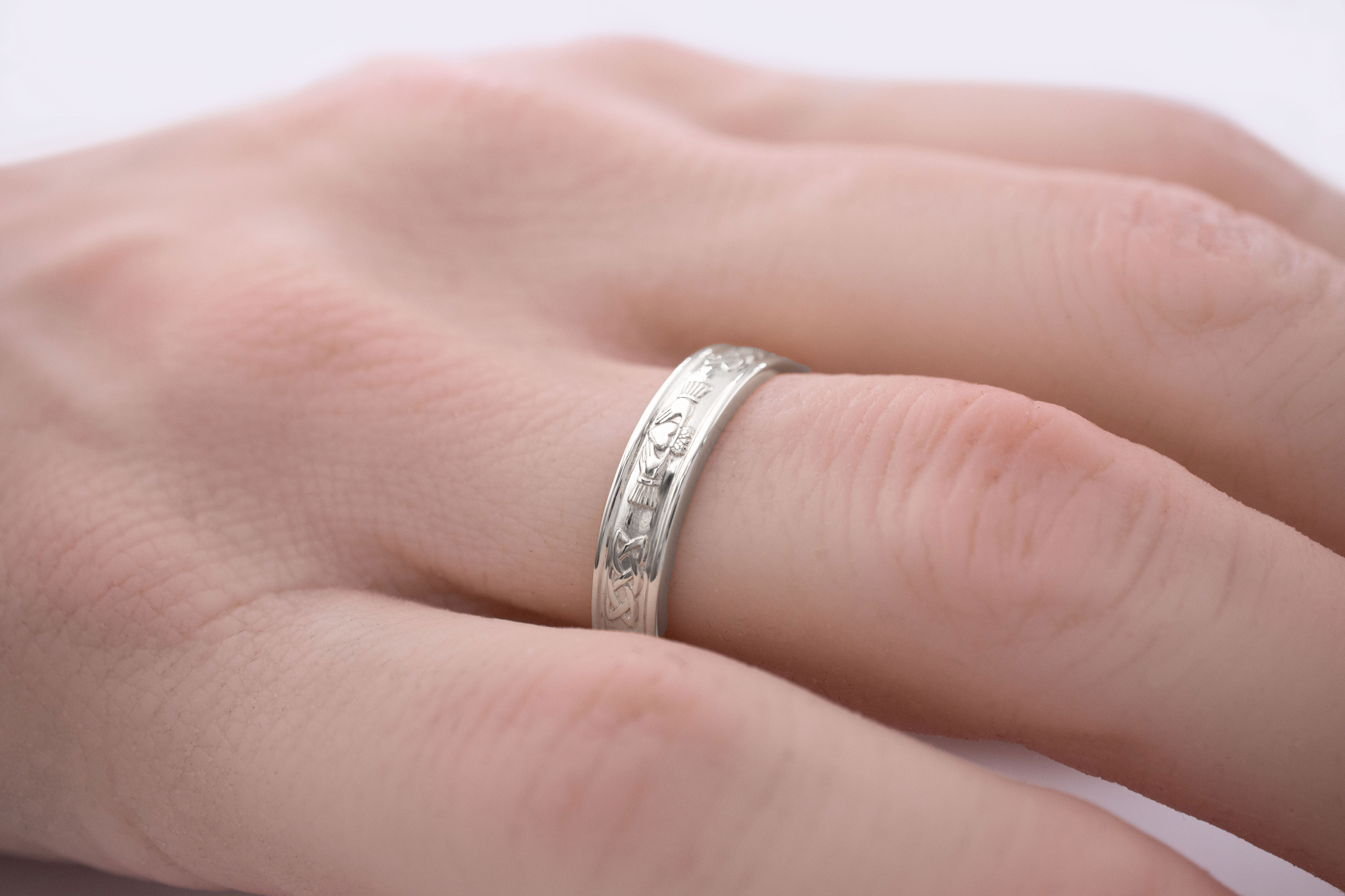 Womens Claddagh & Celtic Knot Ring in White Gold With a Polished Finish - Model Photo