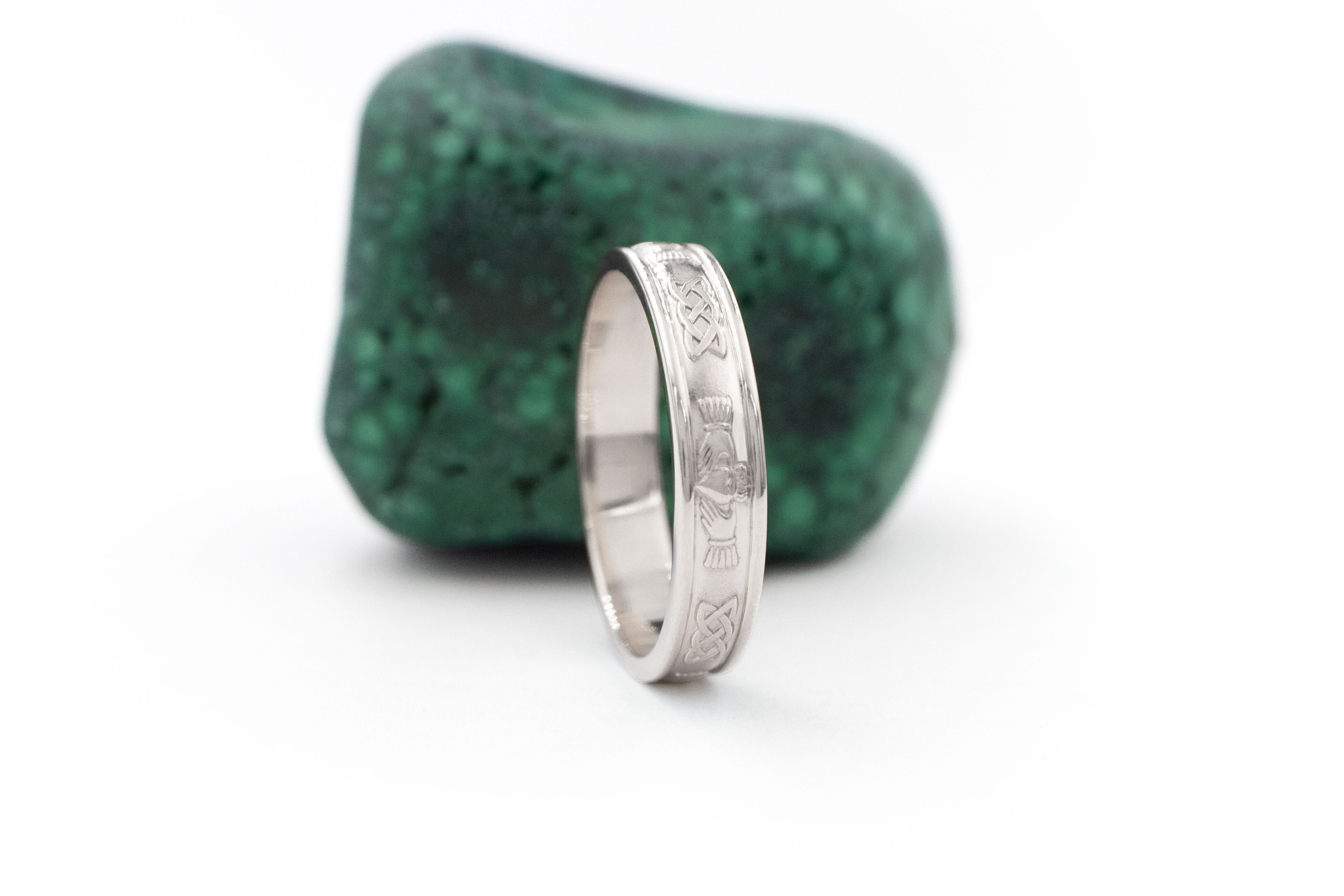 Womens Luxurious Polished White Gold Claddagh 5.0mm Ring. Side View.