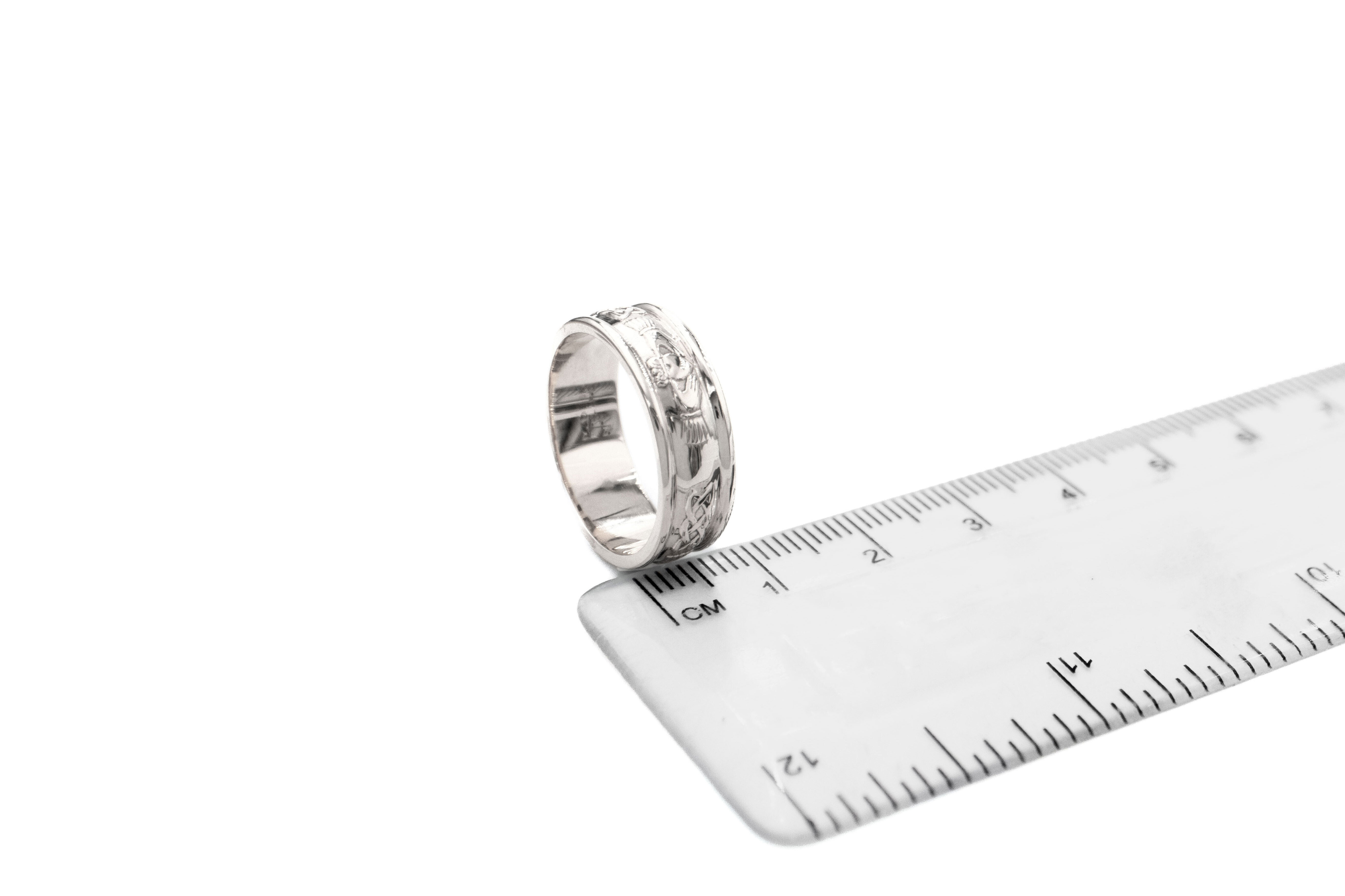 Real White Gold Claddagh 5.0mm Ring With a Polished Finish For Men. Picture For Scale.