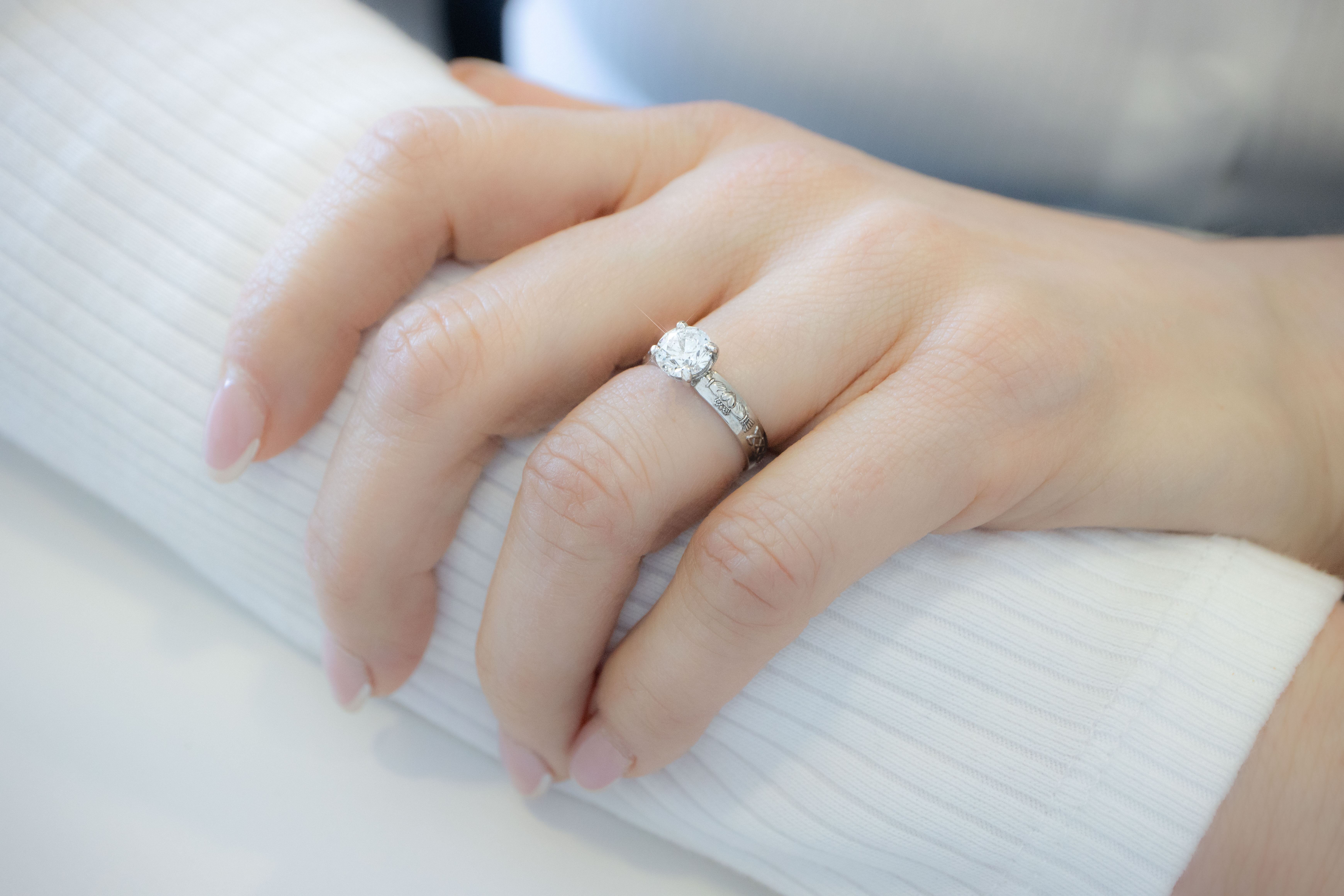 Gorgeous 14K White Gold Claddagh 4.0mm Ring For Women With a Polished Finish - Model Photo