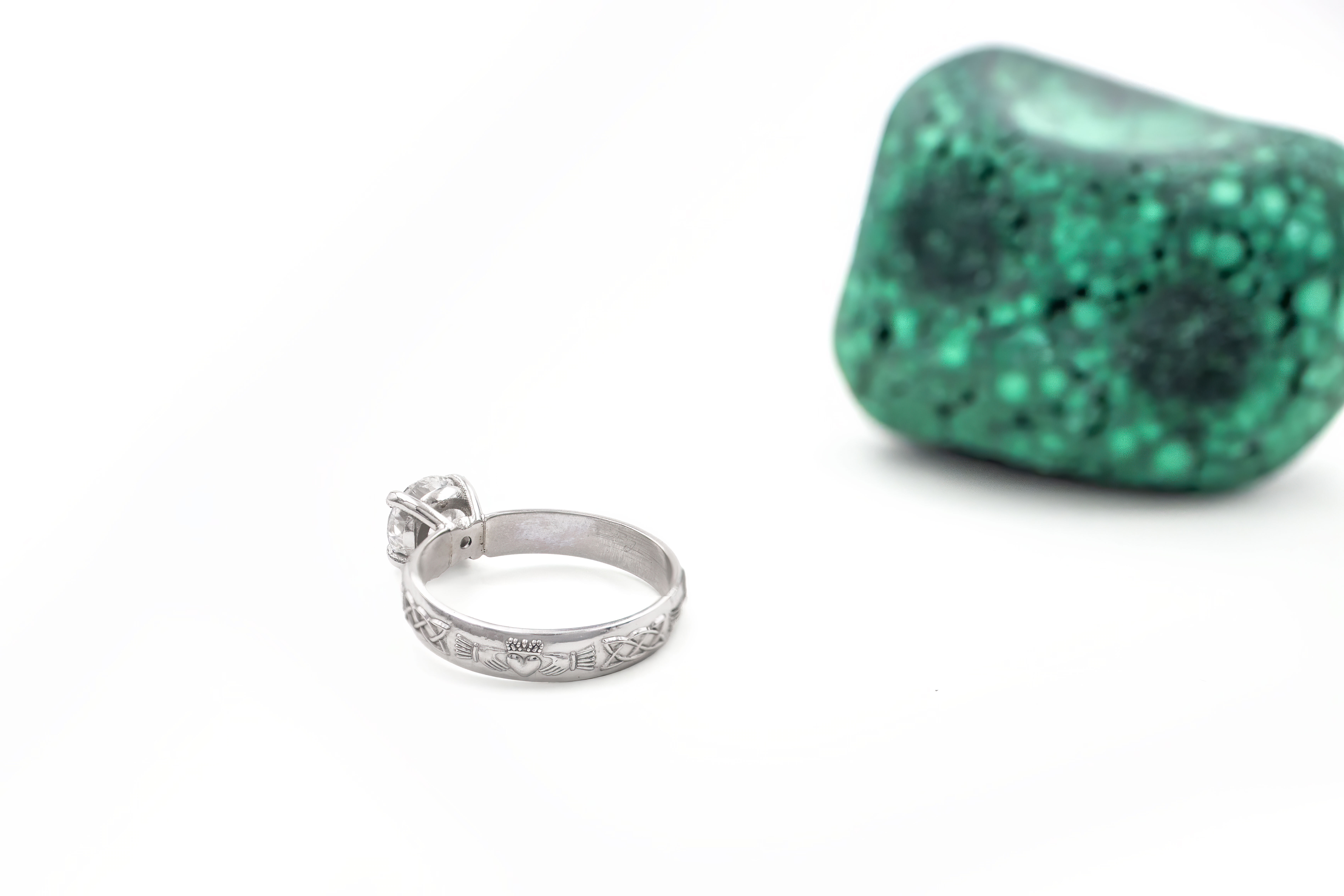 Authentic 14K White Gold Claddagh Ring With a Polished Finish For Women. Side View.