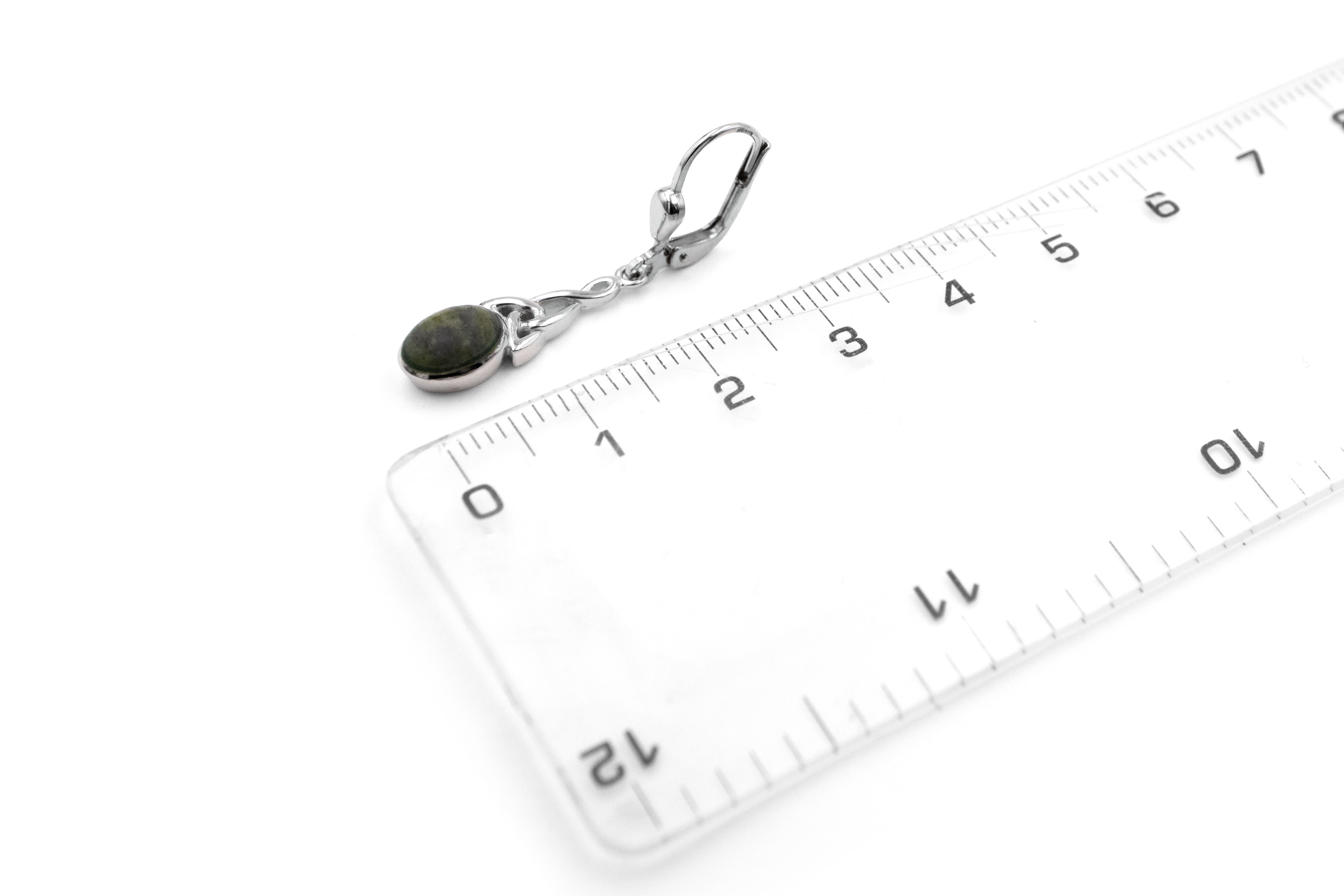 Real Sterling Silver Trinity Knot Earrings With a Polished Finish For Women. Picture For Scale.