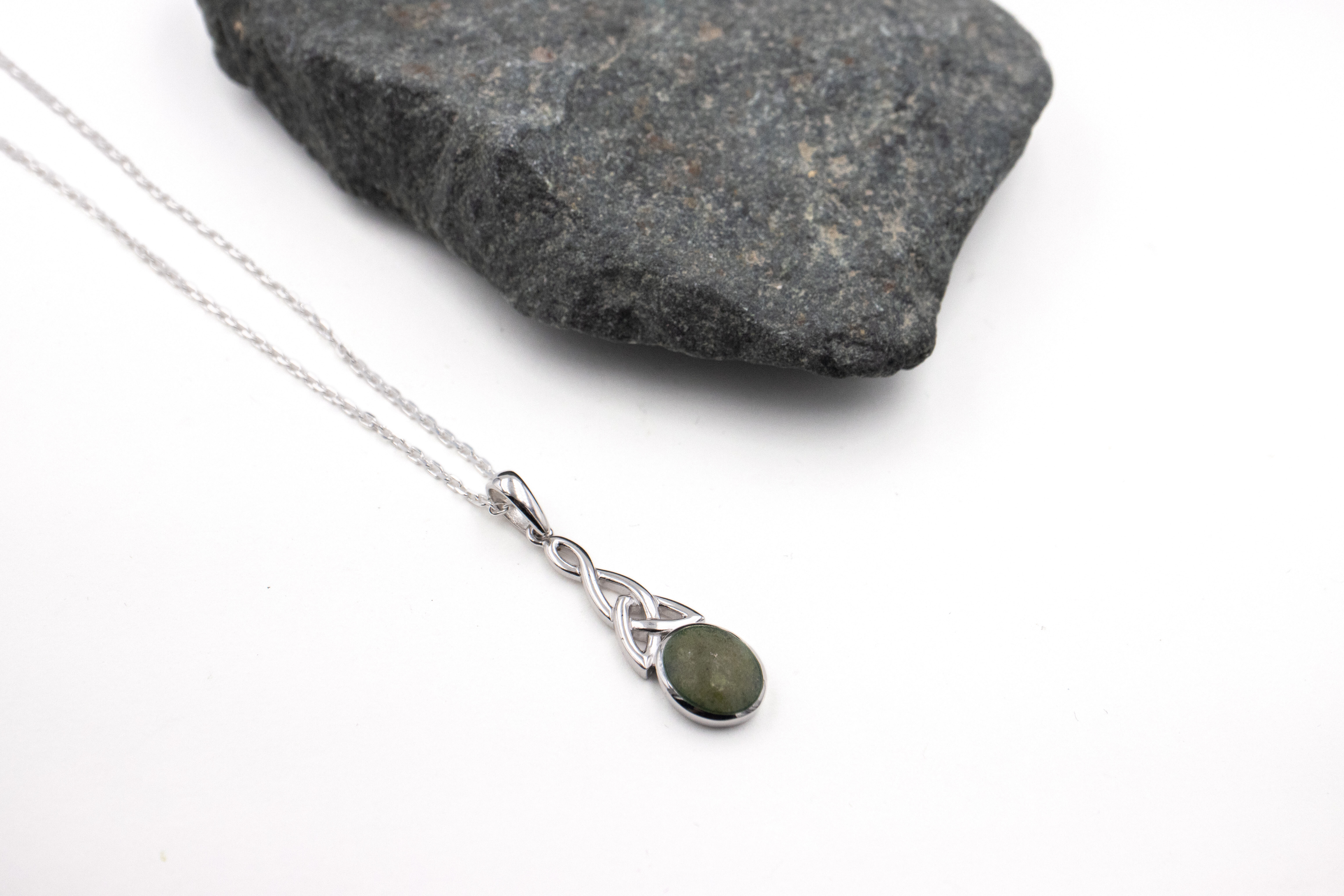Womens Attractive Sterling Silver Trinity Knot & Connemara Marble Necklace. Pictured Flat.