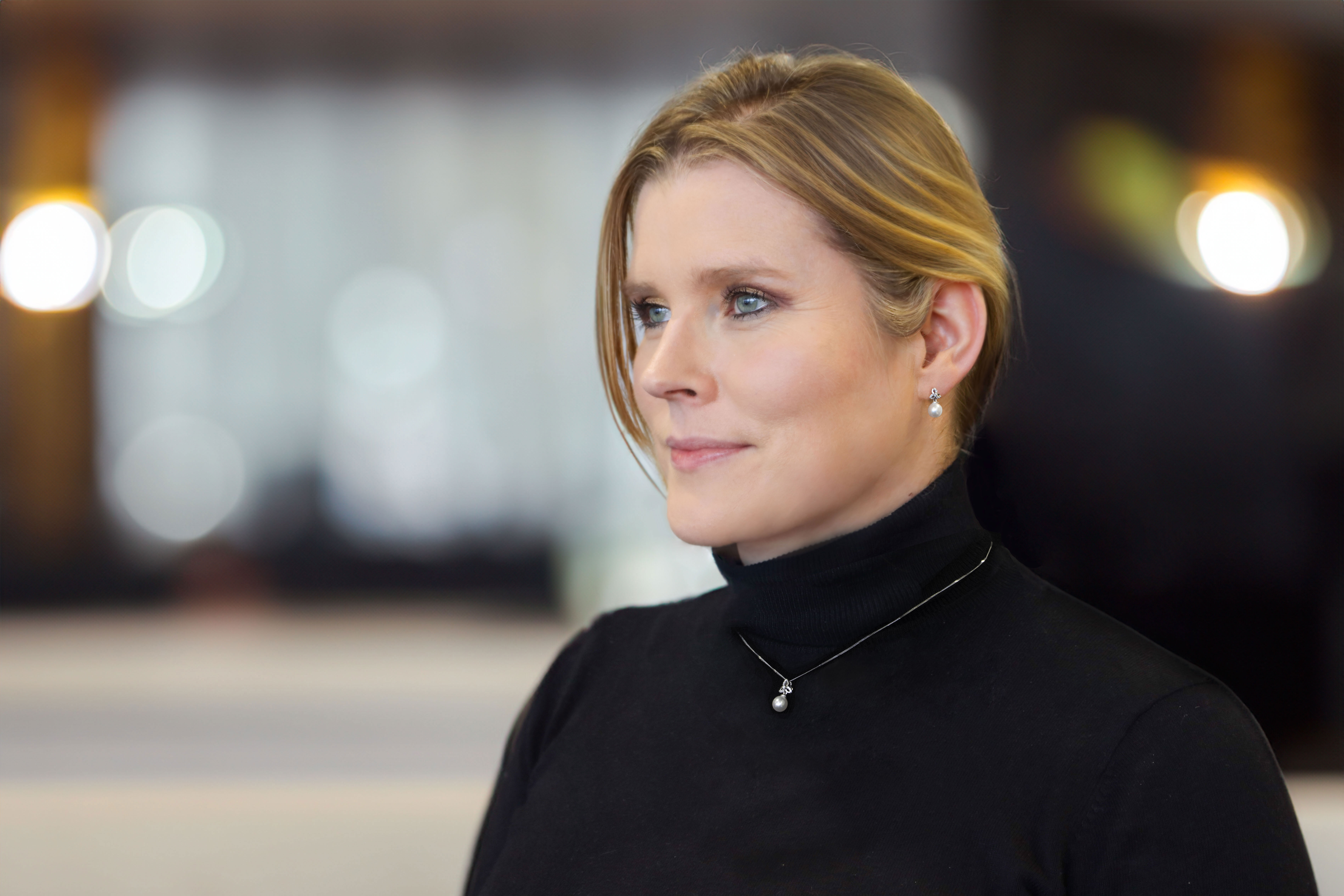 Irish 9K White Gold Trinity Knot Necklace For Women With a Polished Finish - Model Photo