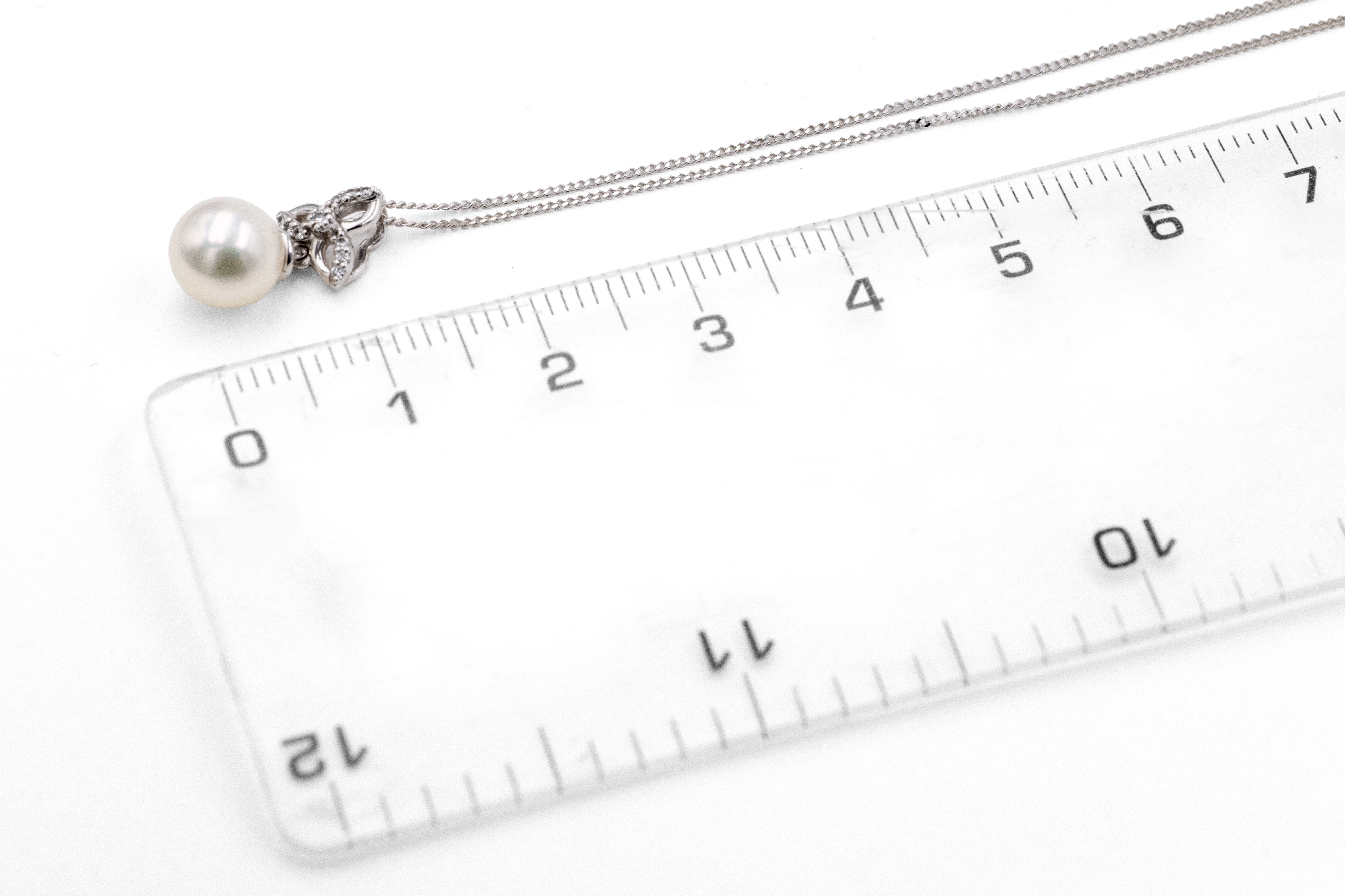 Womens Polished Trinity Knot Necklace in Real 9K White Gold. Picture For Scale.