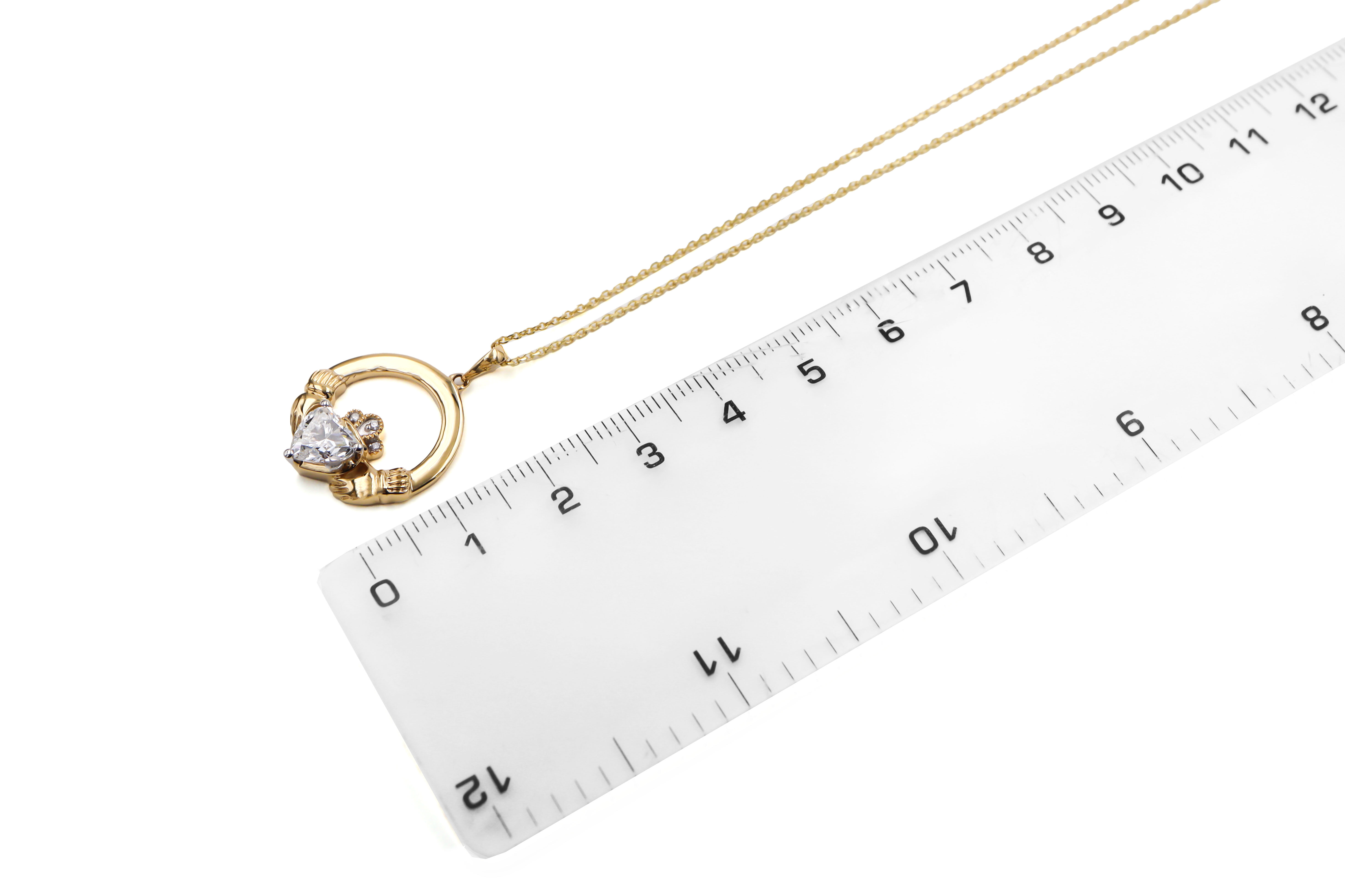 Womens Claddagh Necklace in 14K Yellow Gold. Picture For Scale.