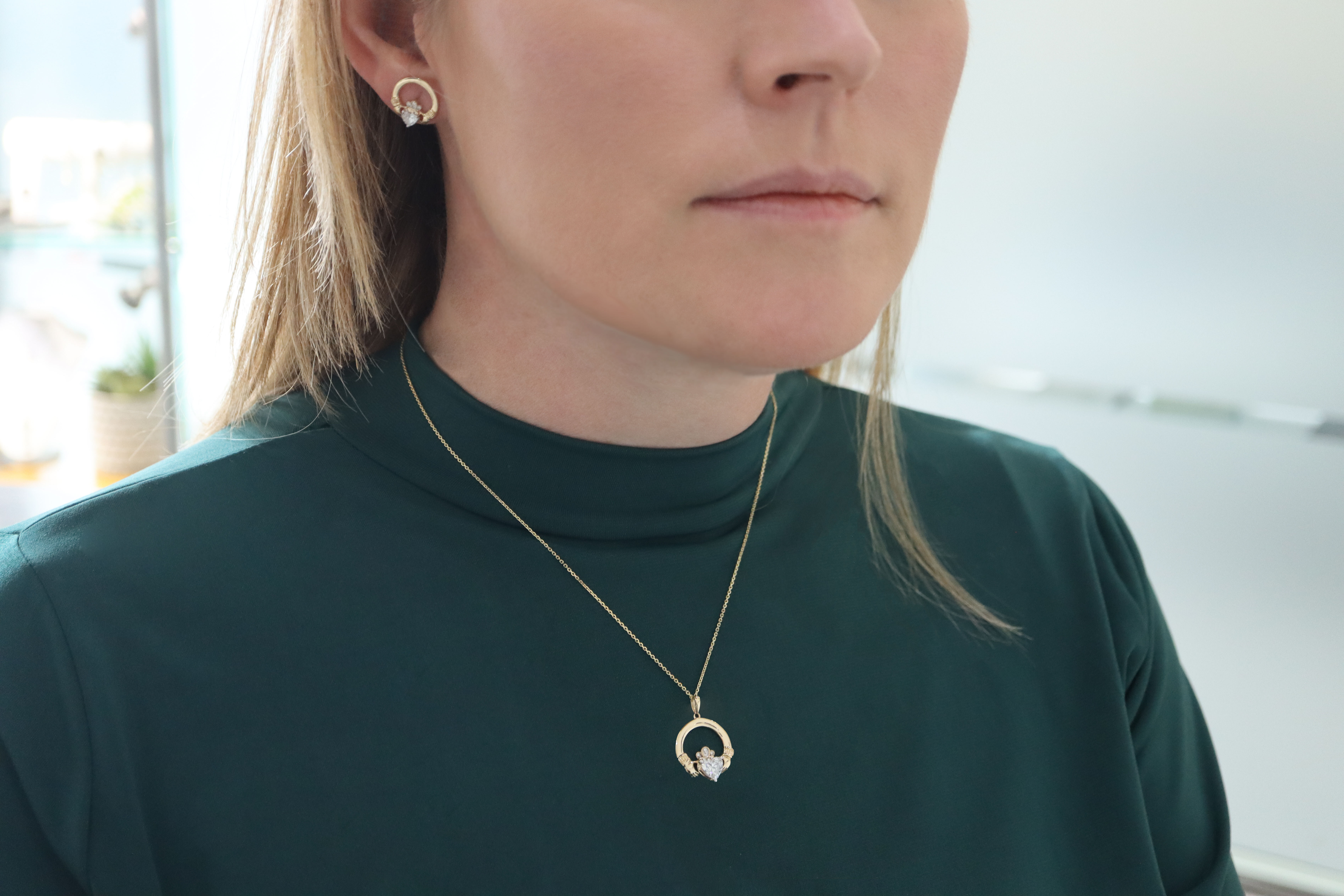 Genuine 14K Yellow Gold Claddagh Earrings For Women With a Polished Finish - Model Photo