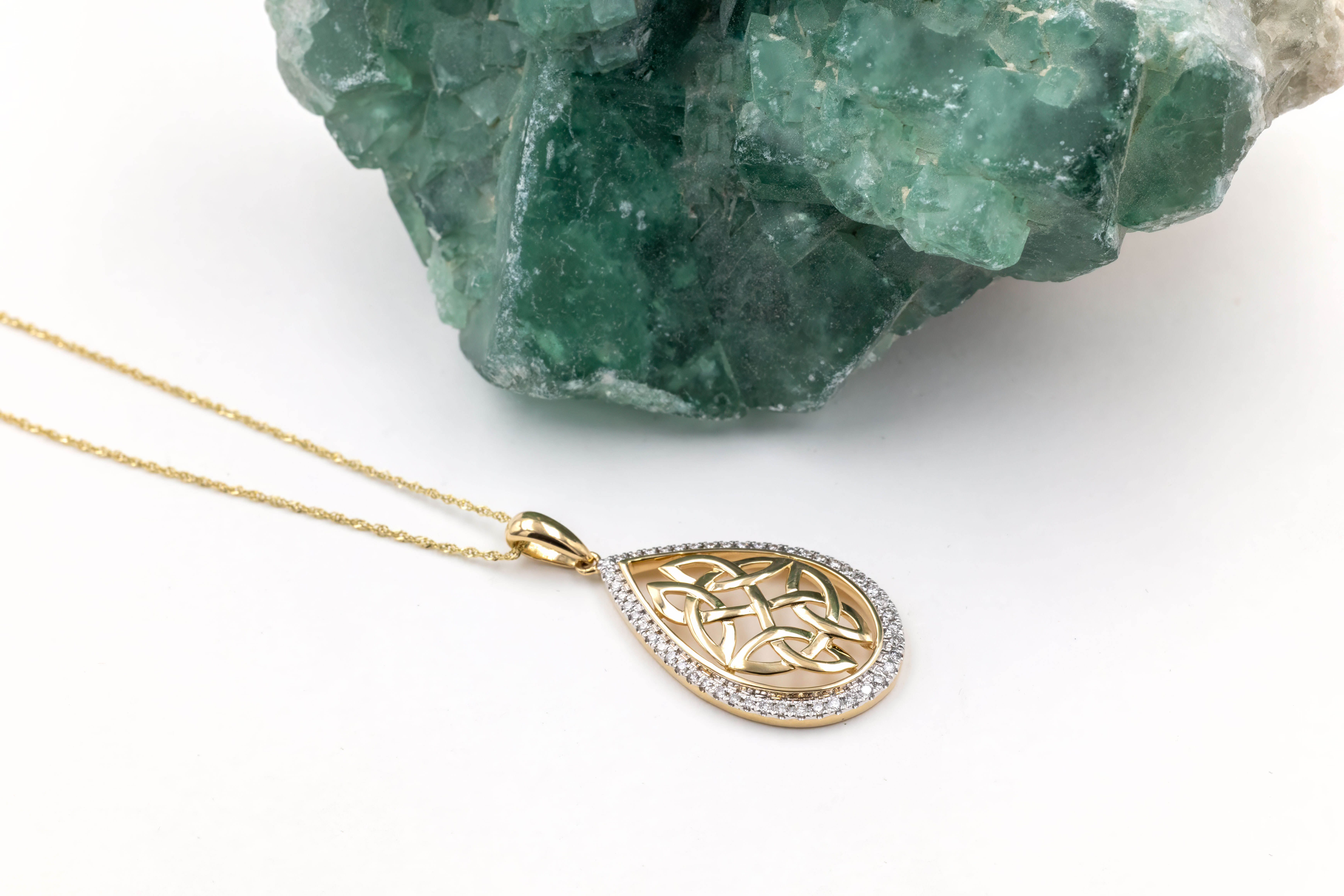 Womens Trinity Knot Necklace in 14K Yellow Gold. Pictured Flat.
