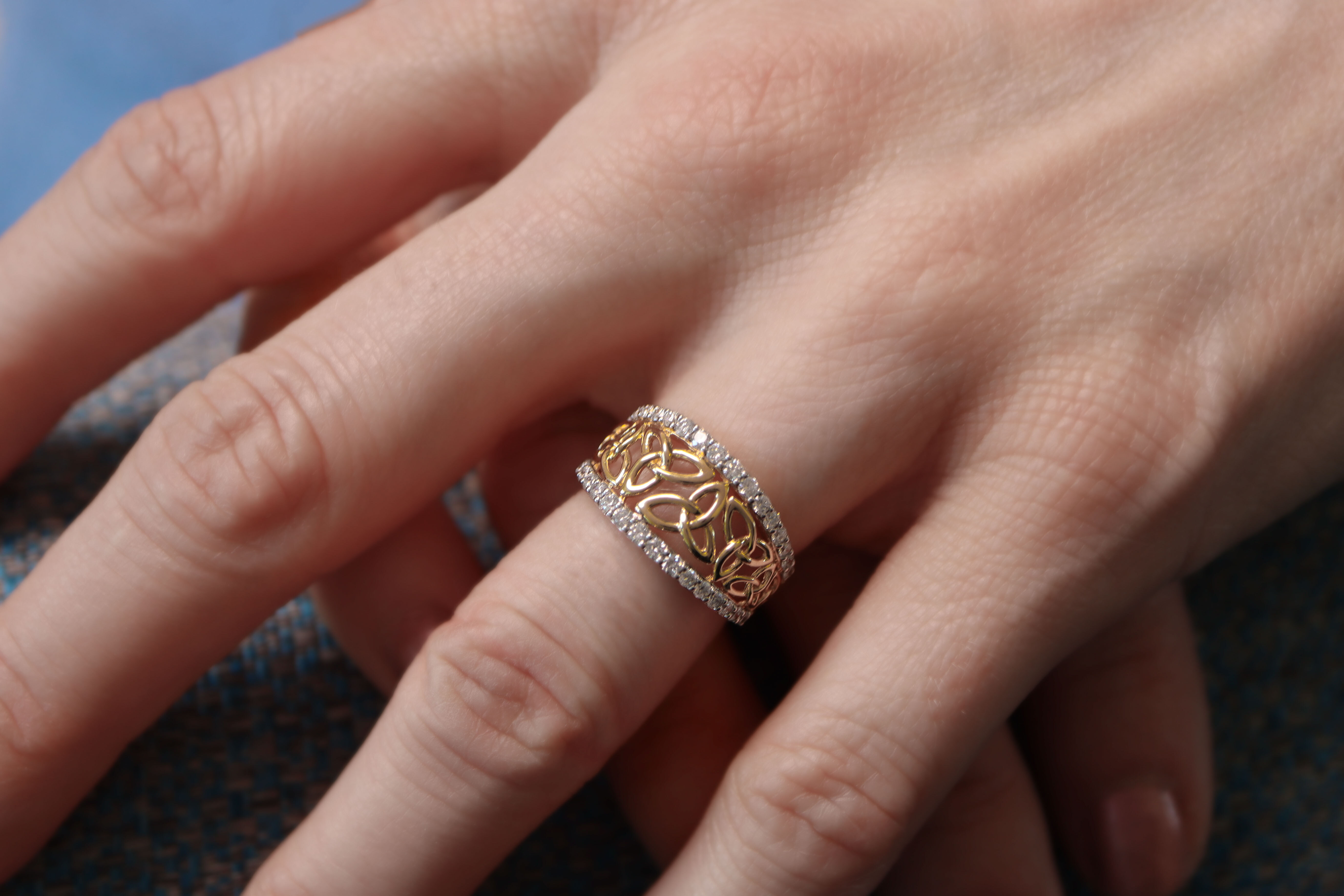 Womens Trinity Knot Ring in 14K Yellow Gold With a Polished Finish - Model Photo