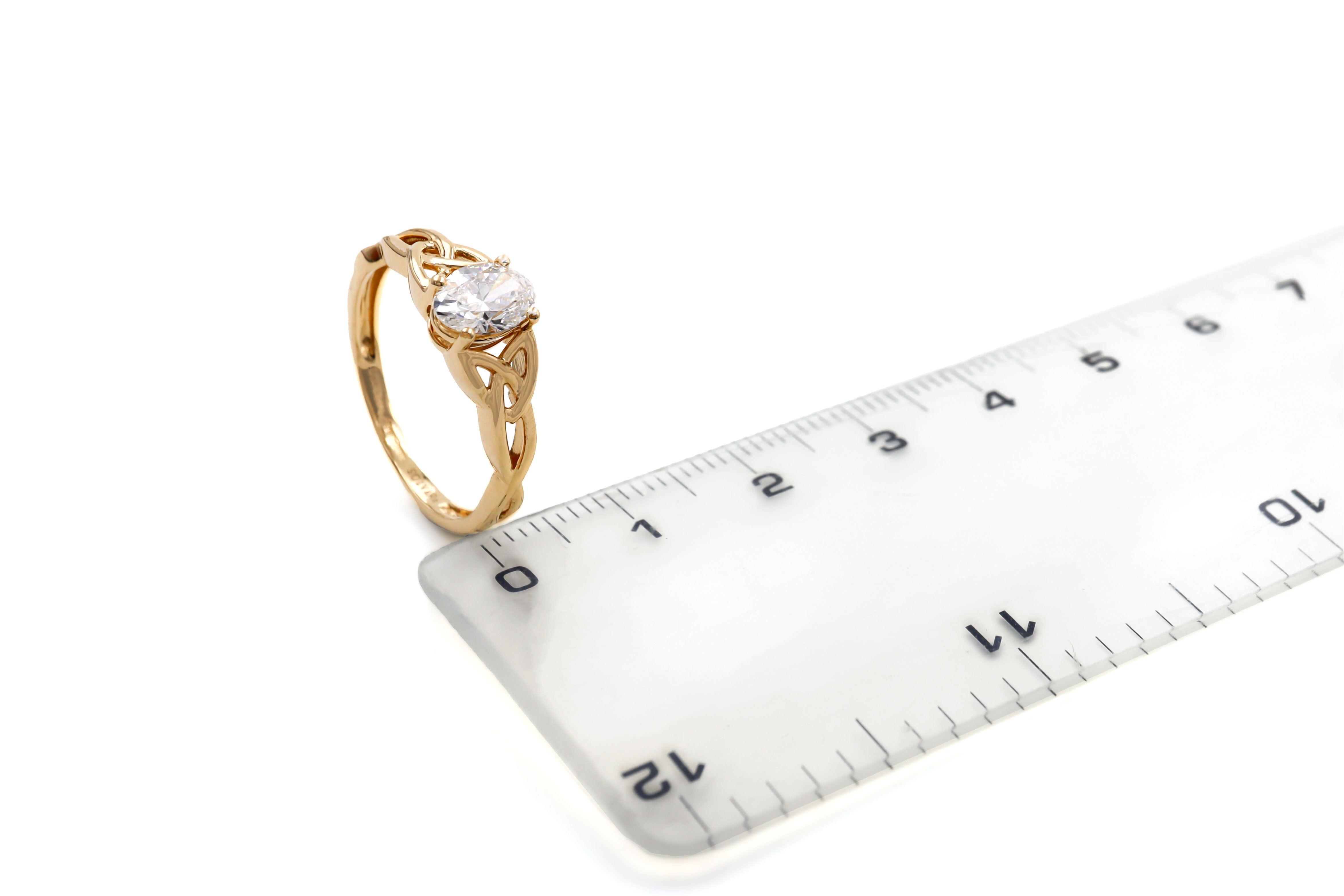 Gorgeous 14K Yellow Gold Trinity Knot Ring For Women With a Polished Finish. Picture For Scale.