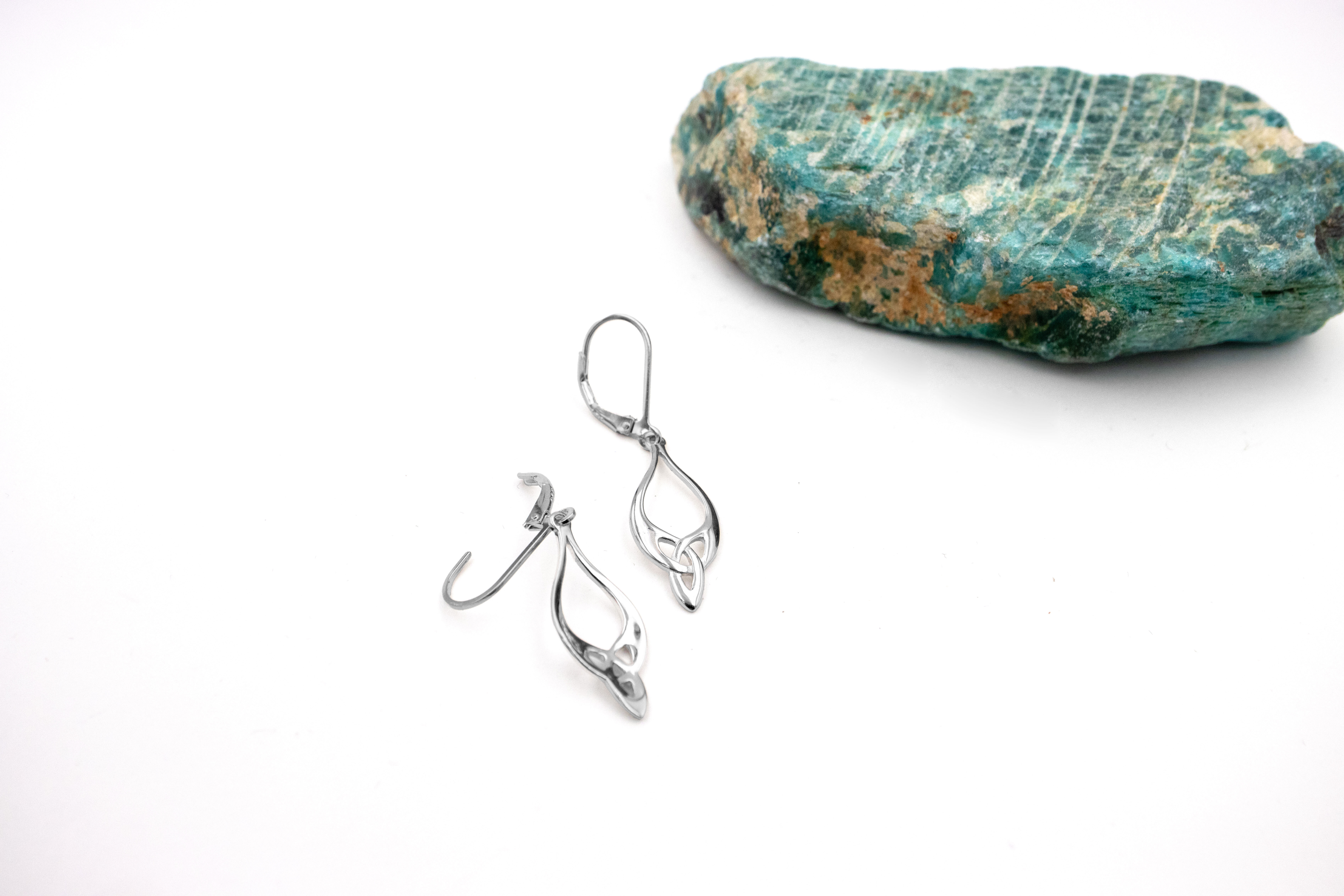 Womens Gorgeous Polished Sterling Silver Trinity Knot Earrings. Pictured Flat.