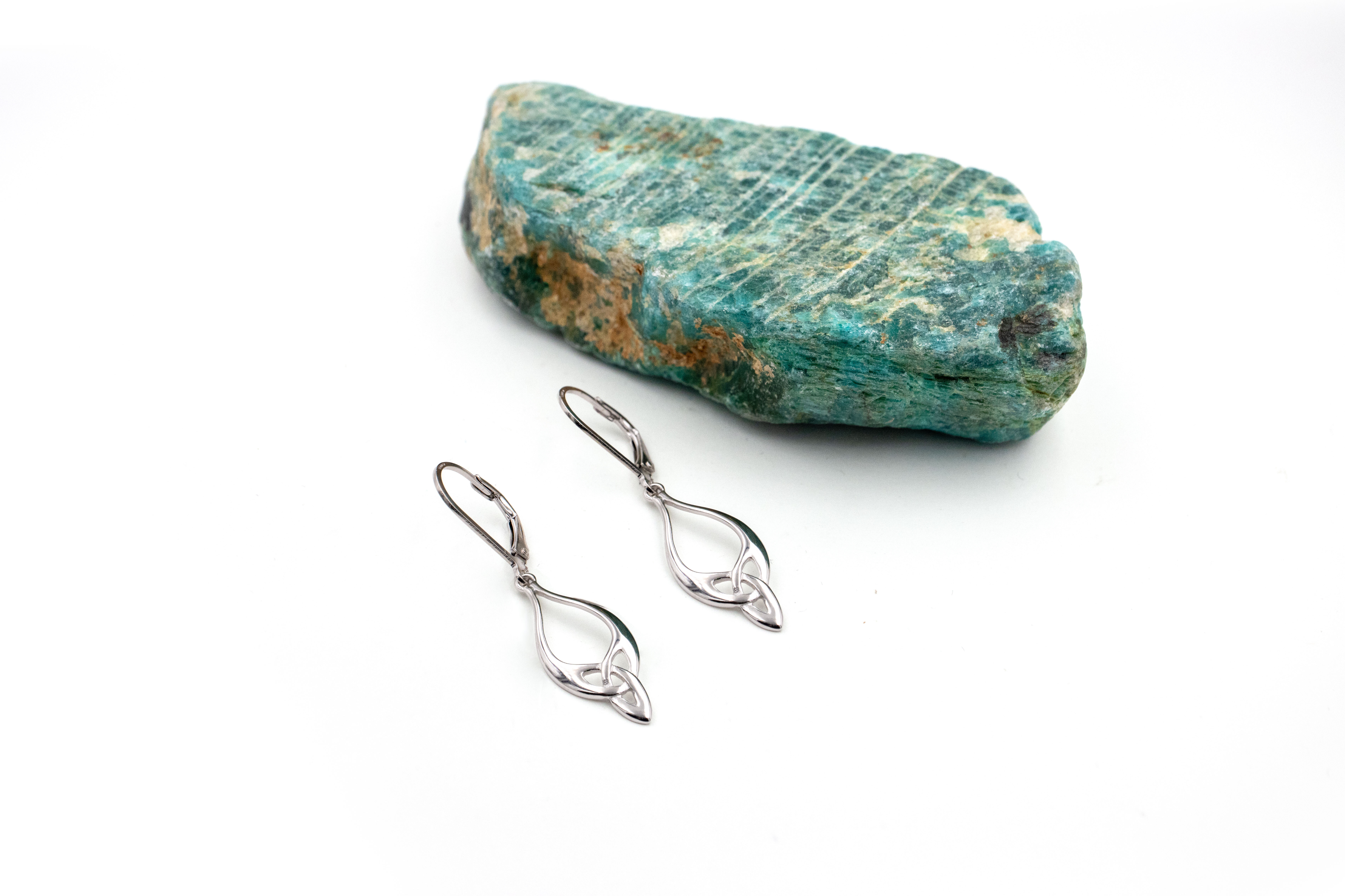 Genuine Sterling Silver Trinity Knot Earrings With a Polished Finish For Women. Pictured Flat.