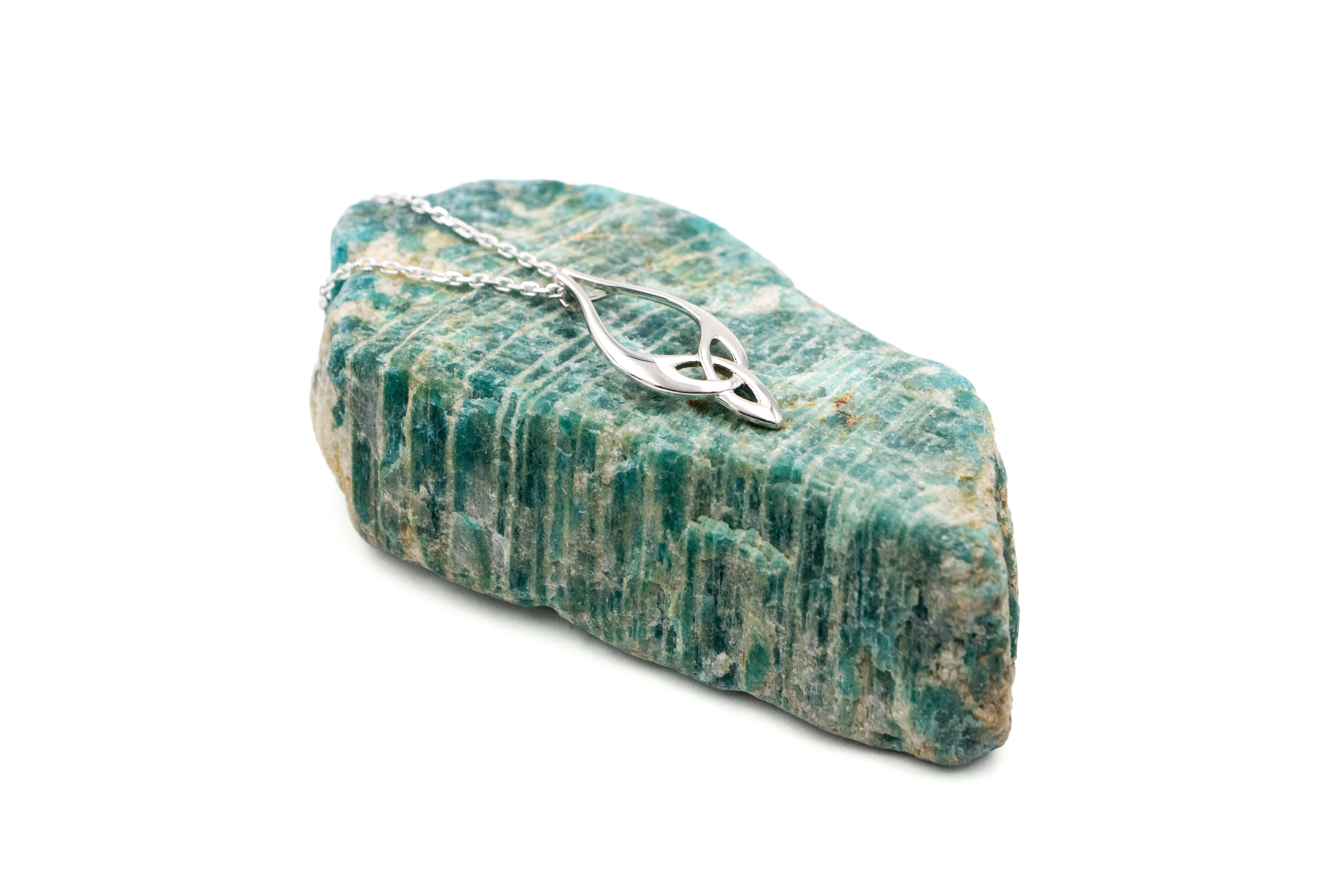 Womens Trinity Knot Necklace in Sterling Silver With a Polished Finish. Pictured Flat.