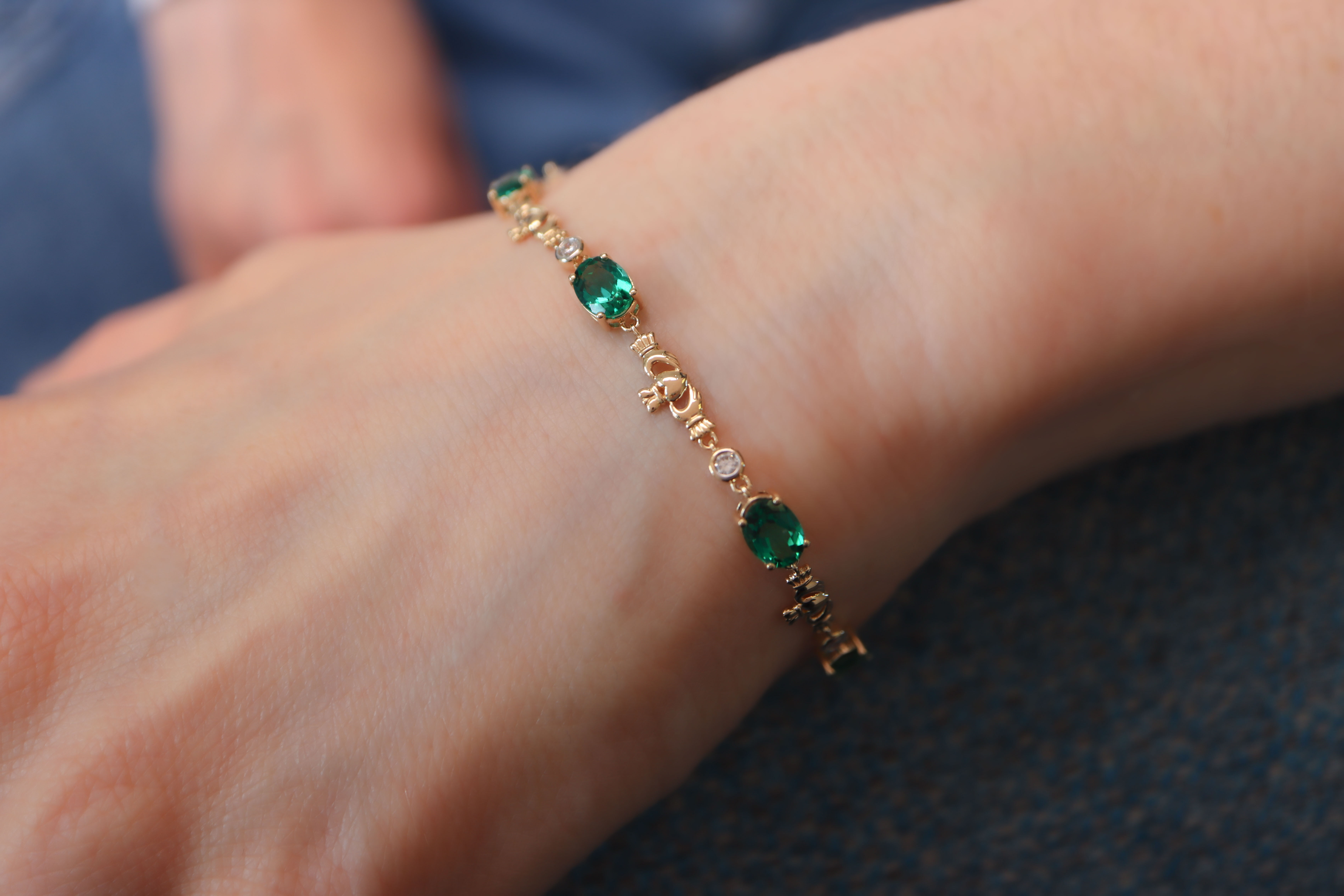 Luxurious Yellow Gold Claddagh Bracelet With a Polished Finish For Women - Model Photo