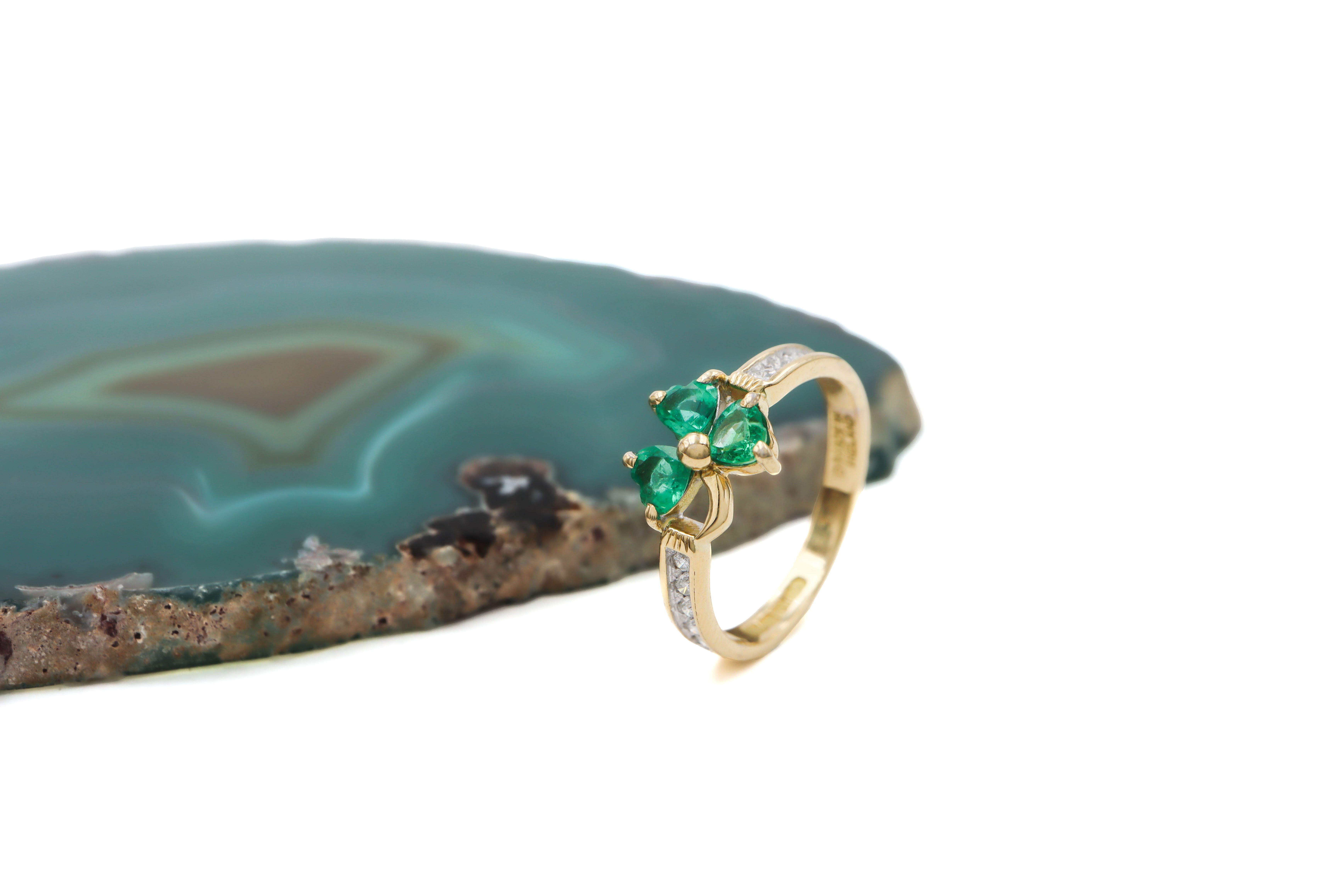 Womens Shamrock Anniversary Ring in 14K Yellow Gold With a Polished Finish. Side View.